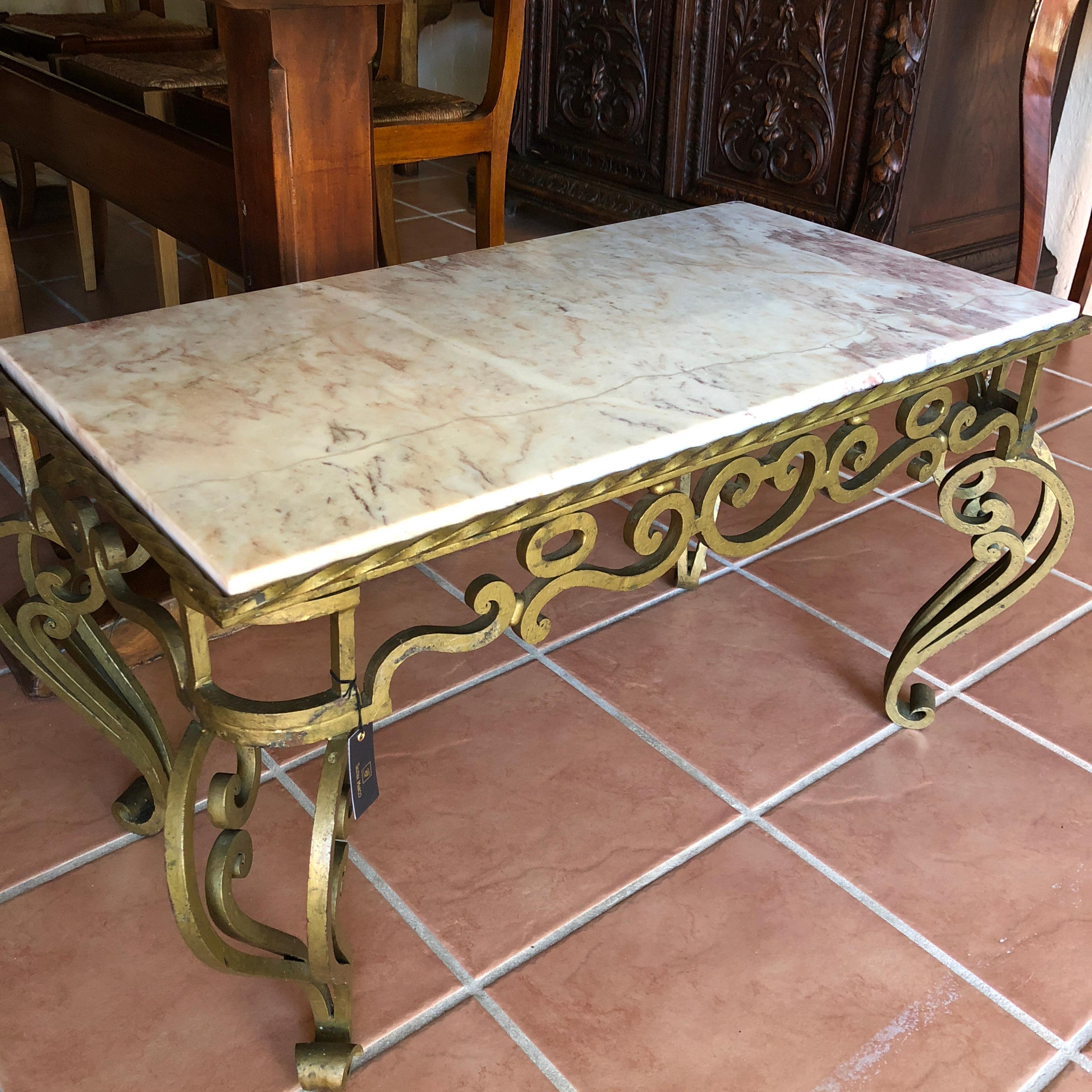 This elegant rose marble French coffee table is the perfect addition to a muted hued living room or formal lounge. Rose marble adorns the top of the table with grey and white veins throughout. The lower portion of the table is made from superb