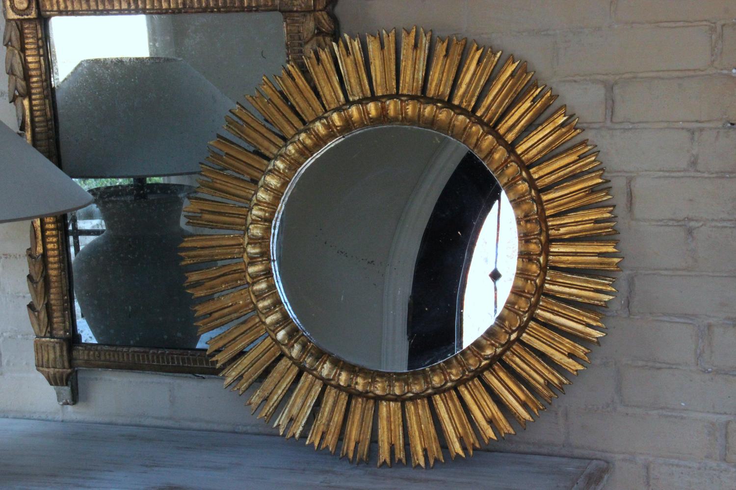 A midcentury French sunburst mirror, circa 1930. Original mirror plate. The mirror is 14 inches in diameter.
