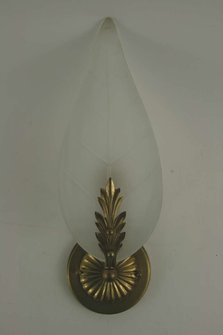 1-4064 pair of foliate brass single arm supporting a frosted glass leaf.