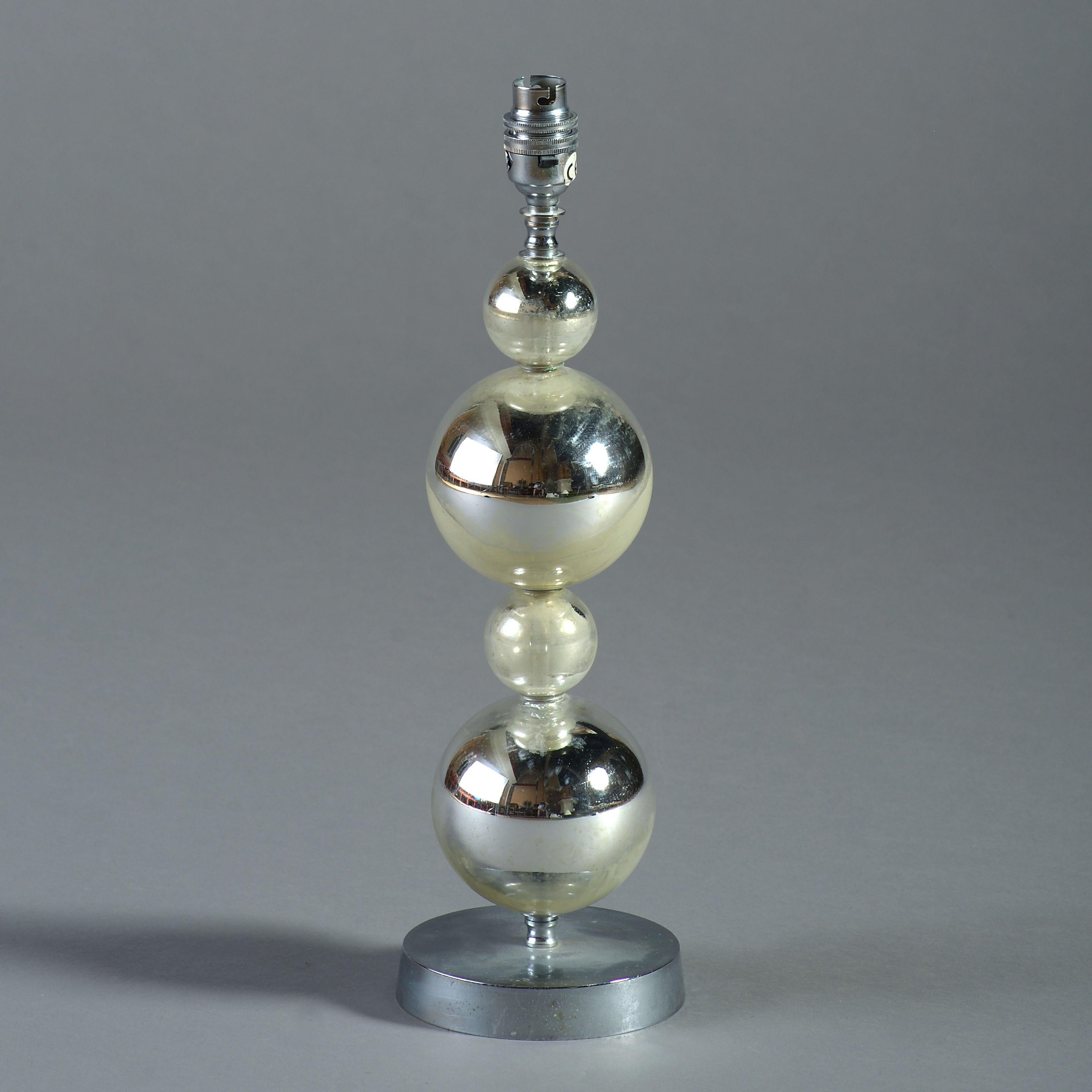 A midcentury silvered glass and chrome lamp base in the futurist taste.
