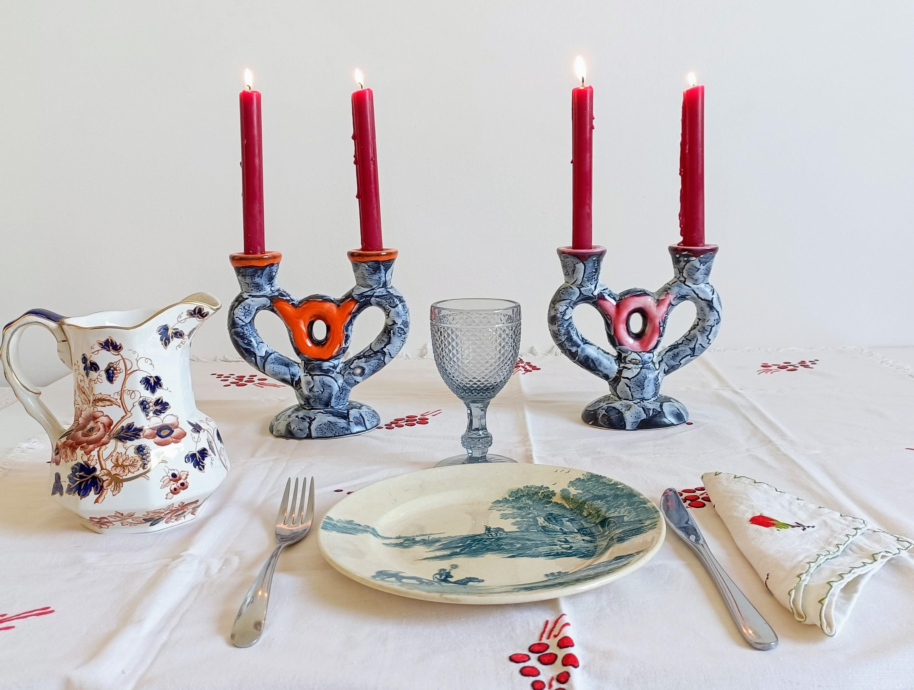 Pair of Whimsical Vallauris Ceramic Candleholders, France, circa 1950s

An exceptional pair of sculptural ceramic candleholders from Vallauris, France, dating to the 1950s. These striking pieces feature a surrealistic heart-shaped form with a