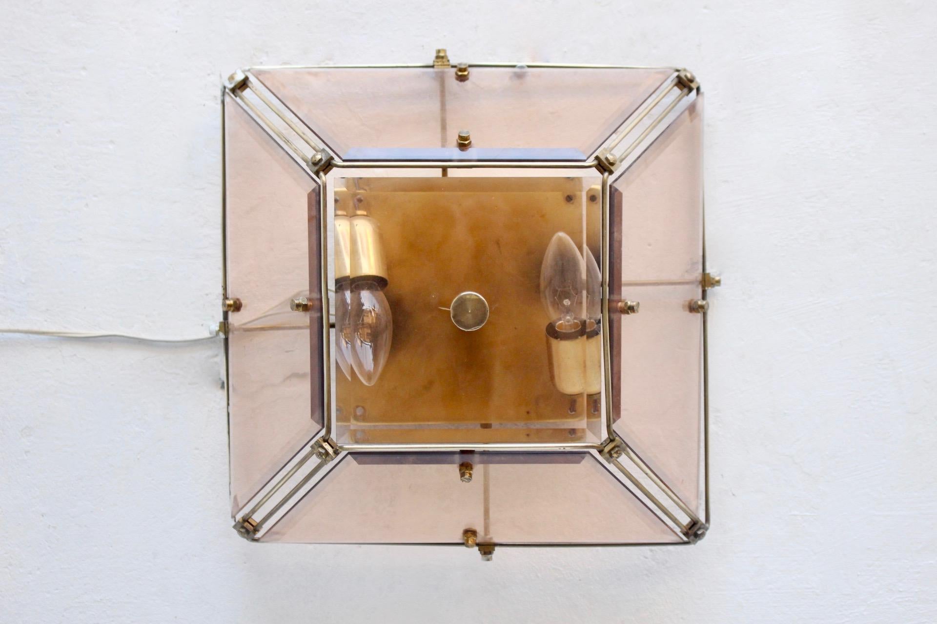Midcentury geometrical brass and beveled amber glass sconce, Spain, 1960s.