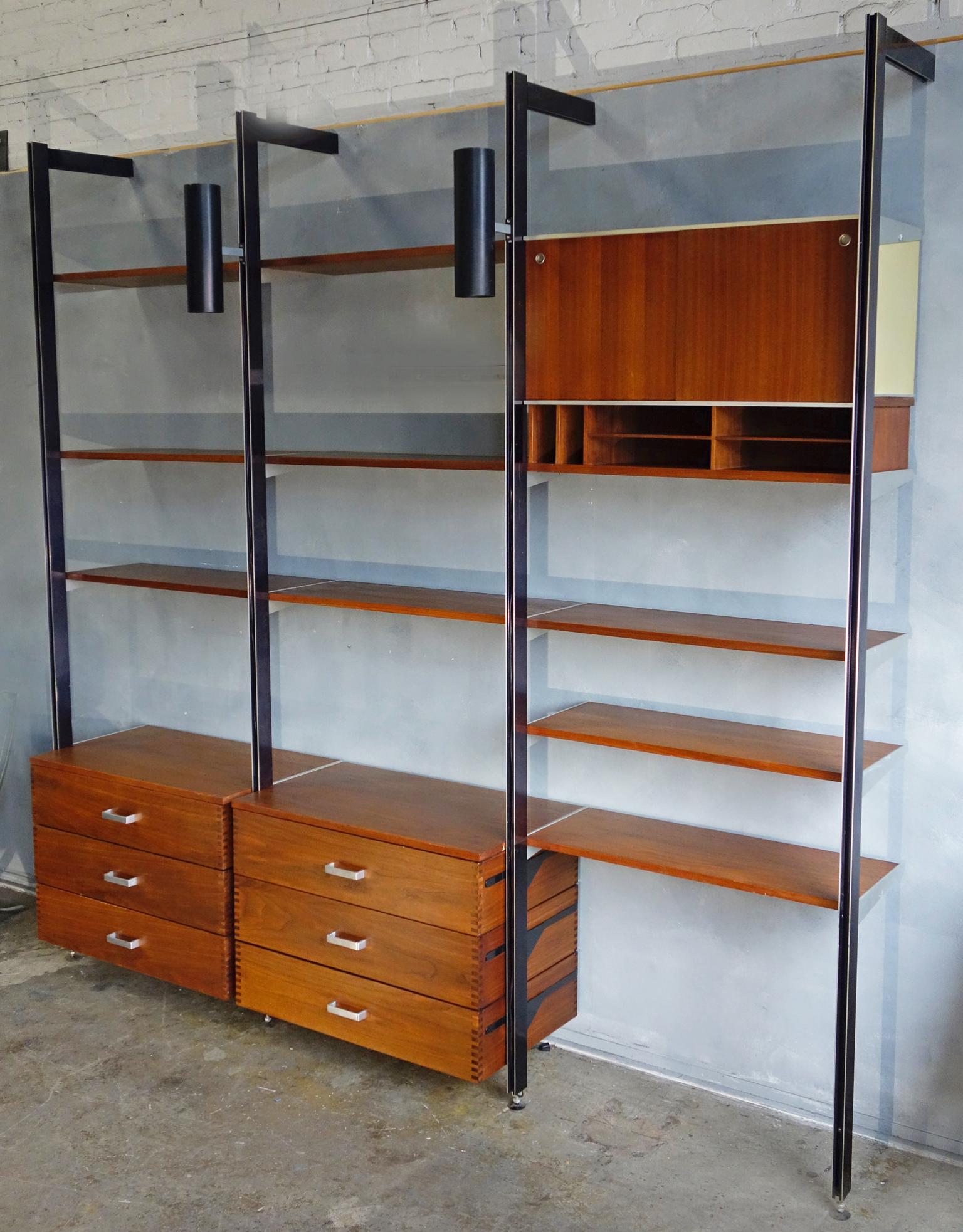 For your consideration is this authentic and original CSS Unit designed by George Nelson for Herman Miller.
A three bay wall unit including the scarce dovetailed drawers.
Also including
9 x 12'' shelves
2 x 18.5