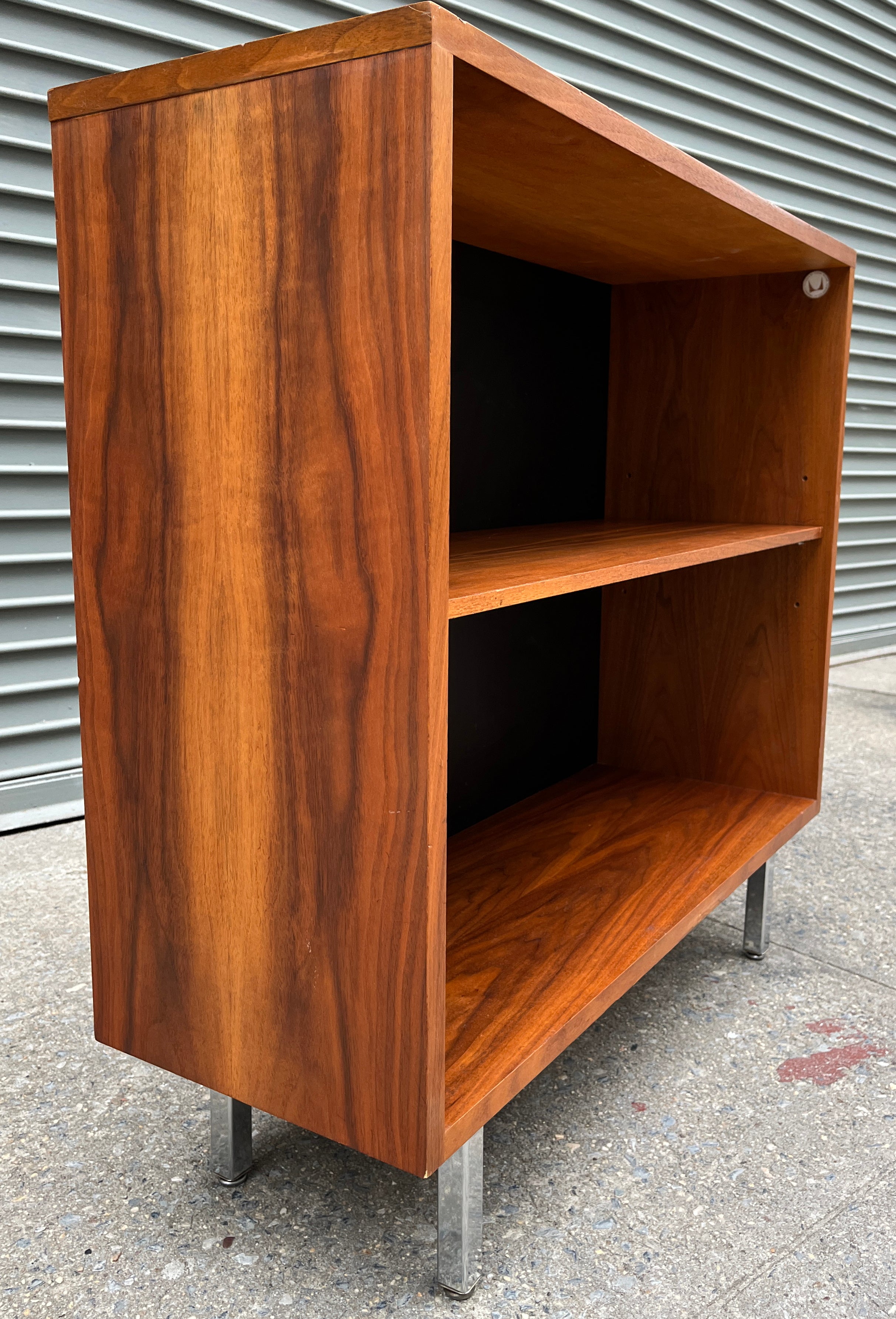 Rare smaller bookcase with great dimensions in walnut on chrome base. Designed by George Nelson for Herman Miller. We have had many Nelson case pieces and never have come across this one before. 