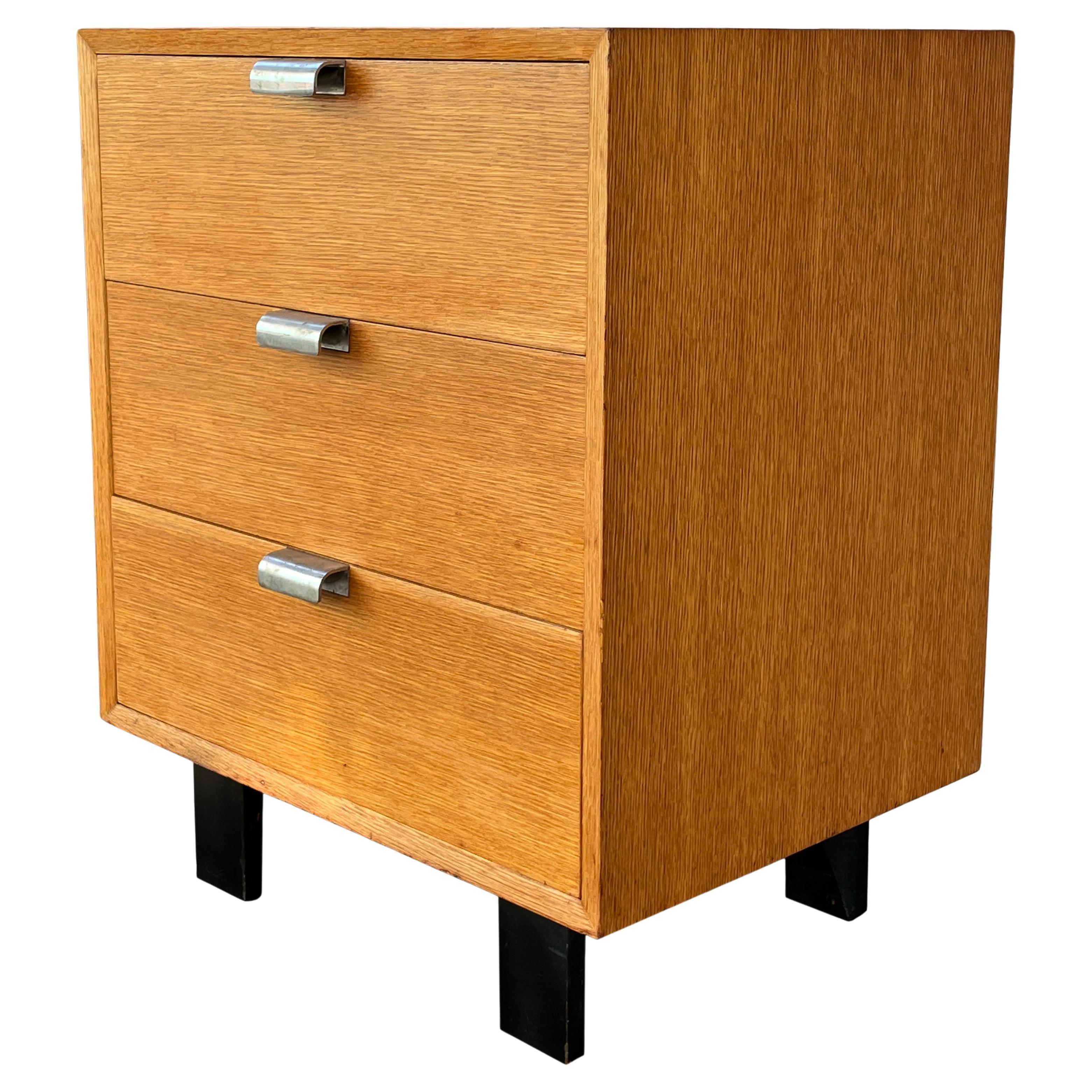 Gorgeous BCS chest of drawers in original brown ash designed by George Nelson for Herman Miller. This is a very early version with plated metal pulls not aluminum and unusual finished back. This versatile unit is a perfect small dresser, nightstand,