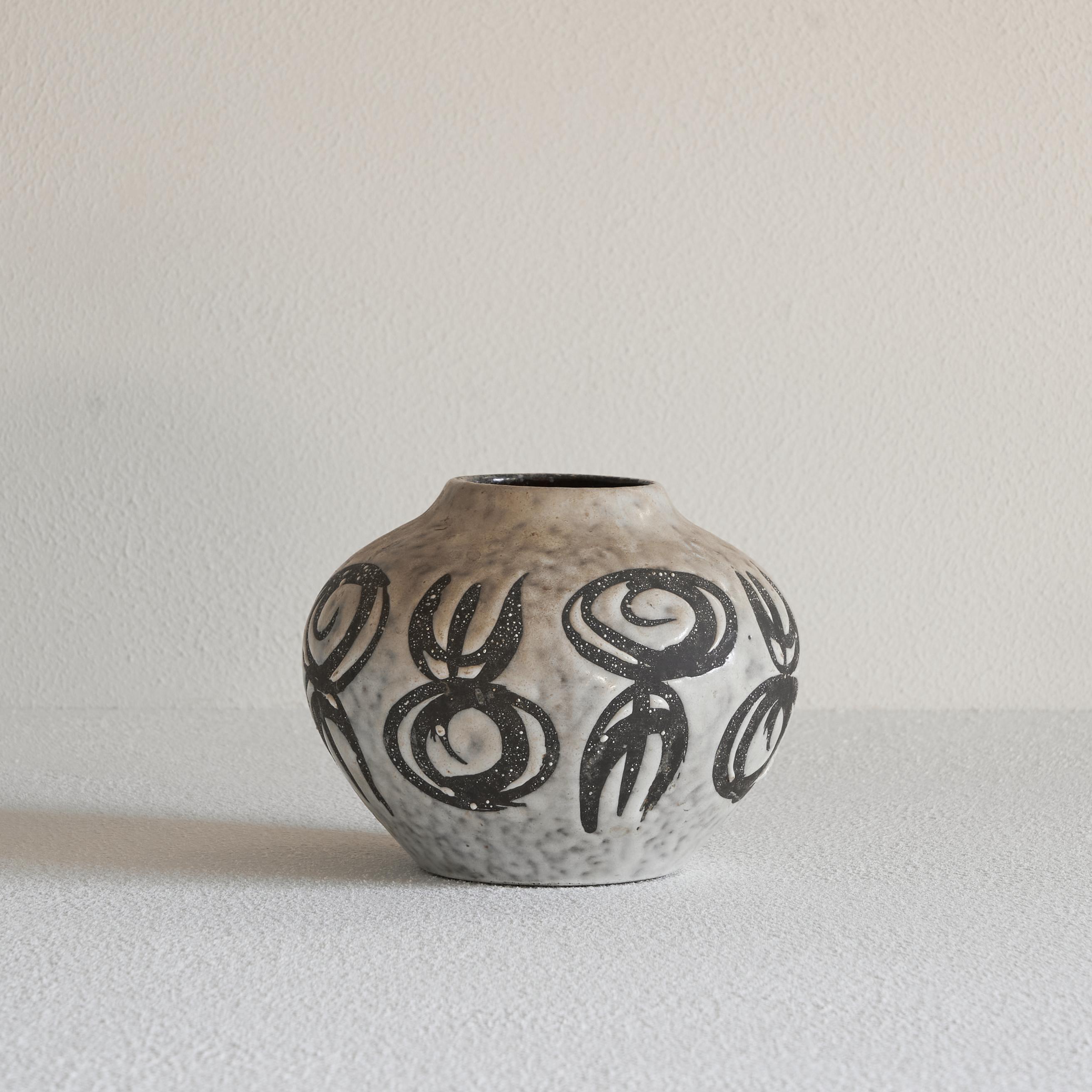 Midcentury German Studio Pottery vase 1960s.

This is a very distinct midcentury German Studio Pottery vase with an interesting abstract and sculptural decor, made by Jasba Keramik in the 1960s. 

Good vintage condition with no faults. 