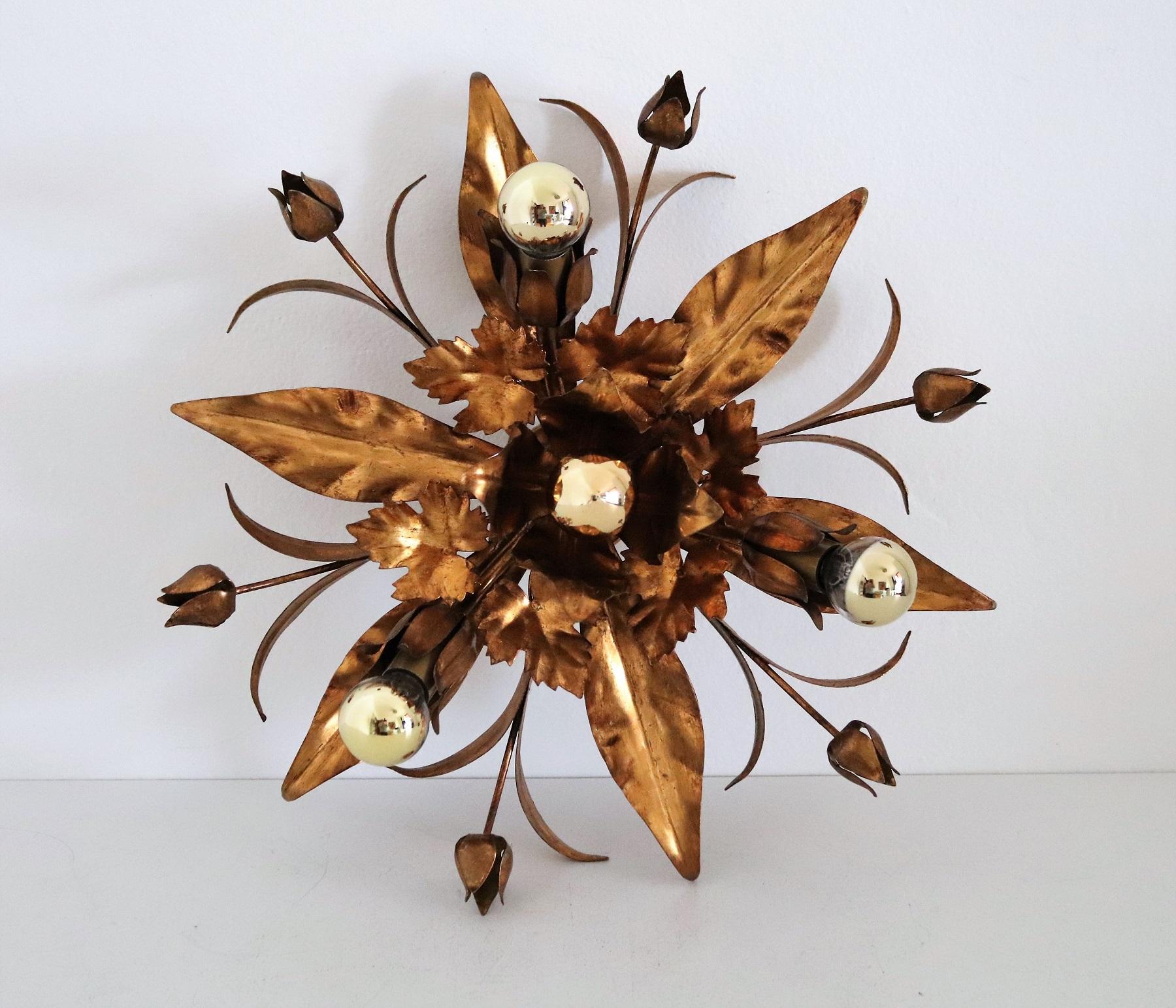 Gorgeous flush mount light or wall lamp made of quality gilt metal in the shape of flowers and leaves.
Equipped with 4 new sockets for small standard E14 bulbs.