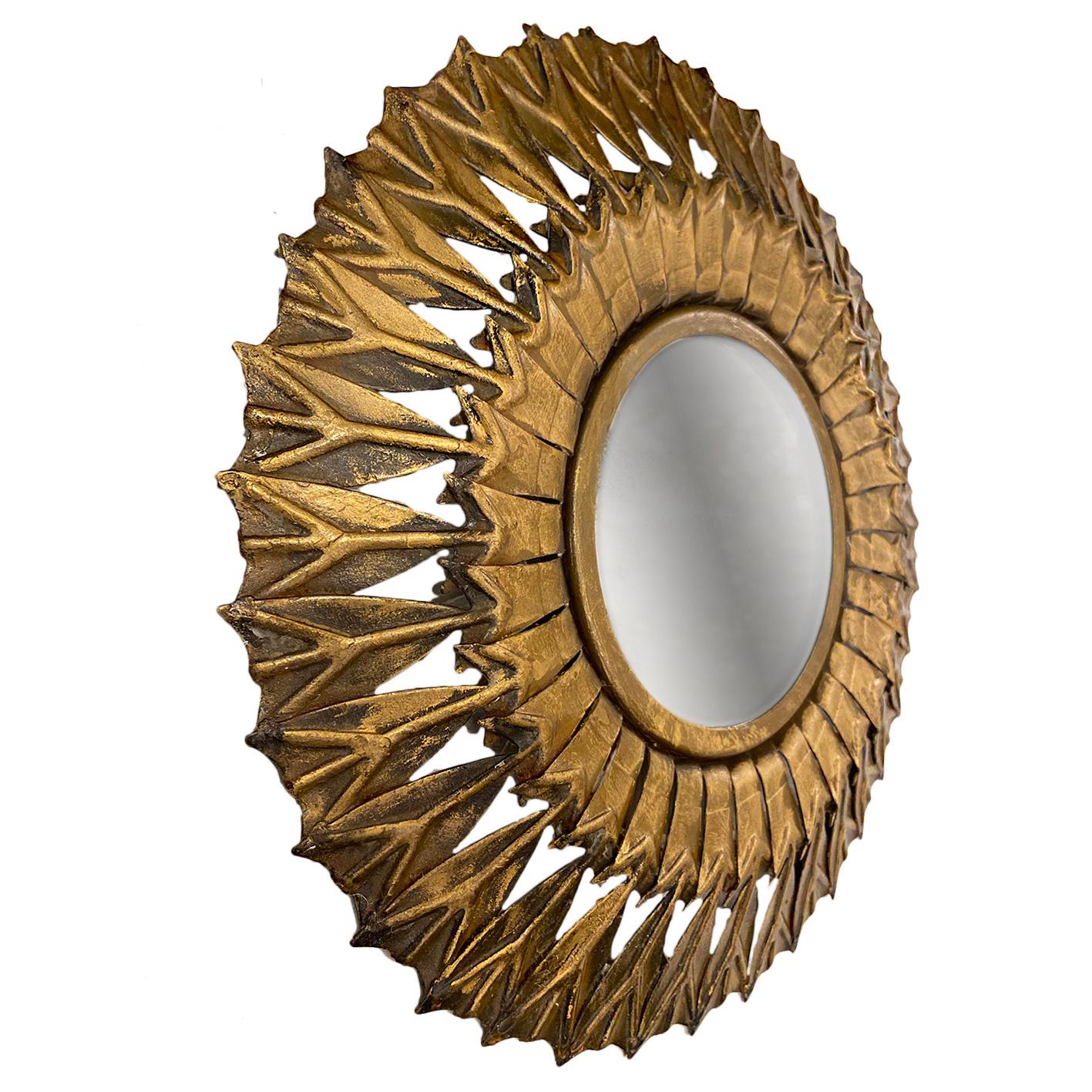 A circa 1950s gilt metal sunburst mirror with original patina.

Measurements:
Diameter 17