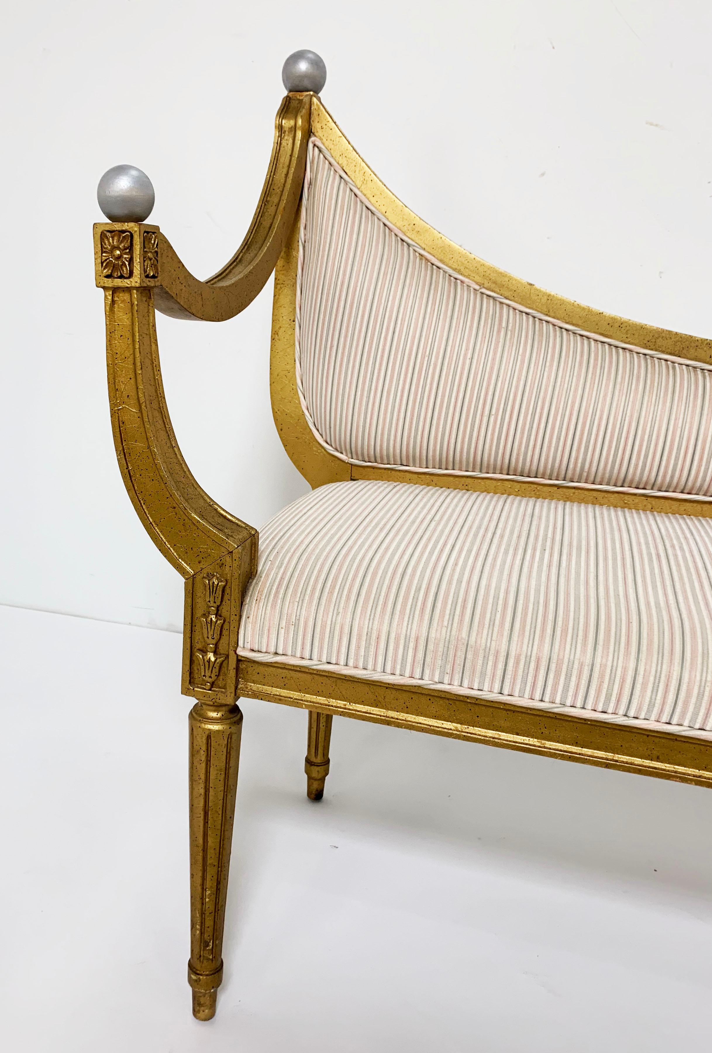 Midcentury giltwood settee in the neoclassical style. Unmarked, most likely Italian.