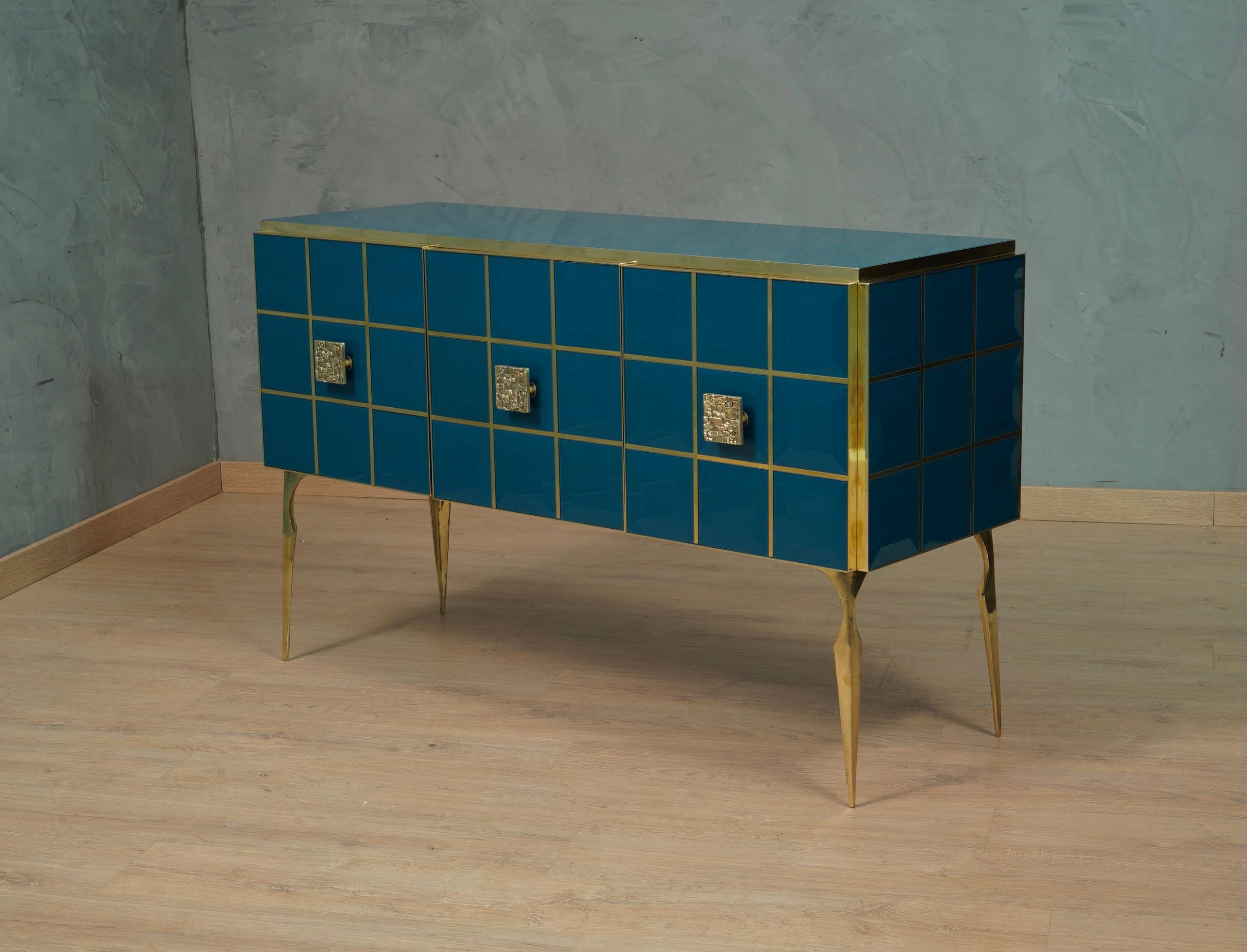A unique sideboard of its kind for its originality and for the choice of materials. Simple but refined design, note the veneer and well polished internal part. Note the rich workmanship of sides and doors, with ground colored glass squares