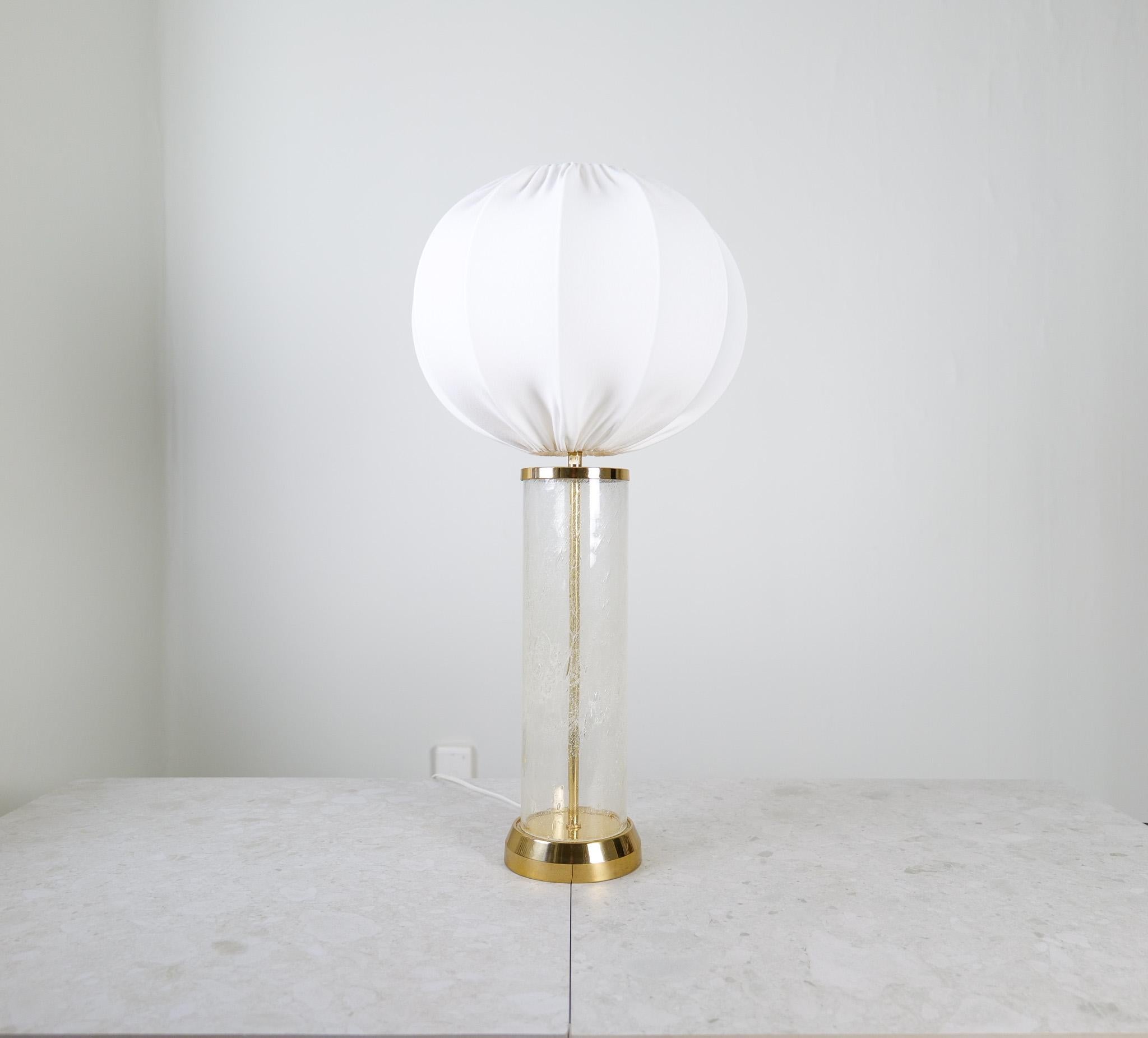 
This glass and brass table lamp were produced by Bergboms lamp factory in Sweden. Wonderfully glass that goes well with the brass given this a great modern look. 

Good vintage condition, new cotton shade produced in Sweden, 

Dimensions: H 62 cm D