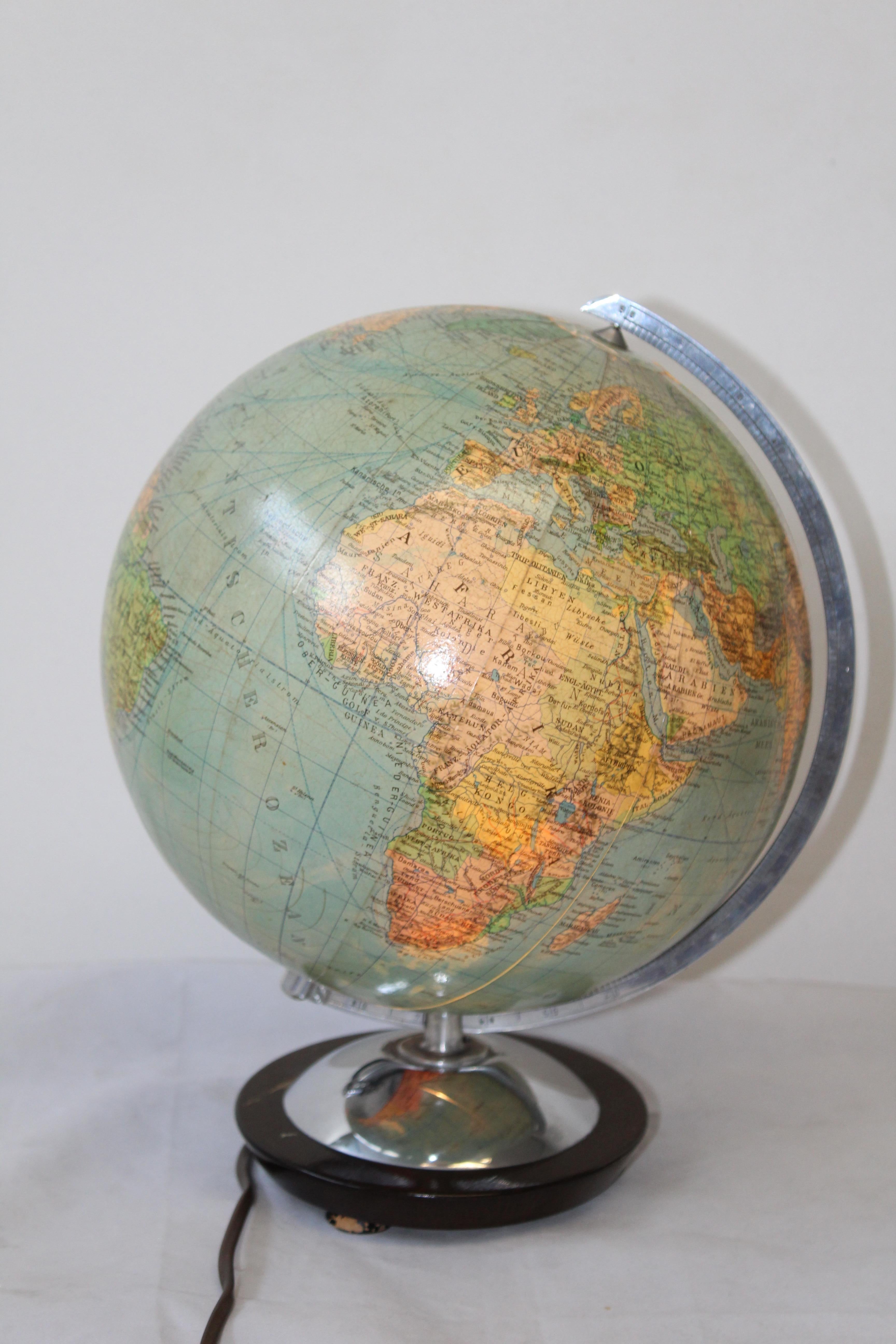 Midcentury glass globe with light from Columbus DuoErdglobe, Germany.

This beautiful vintage Globe has a chrome base.

This globe comes from the 60s and is made in Germany.

Made by Verlag and design by Paul Oestergaard.

The globe is