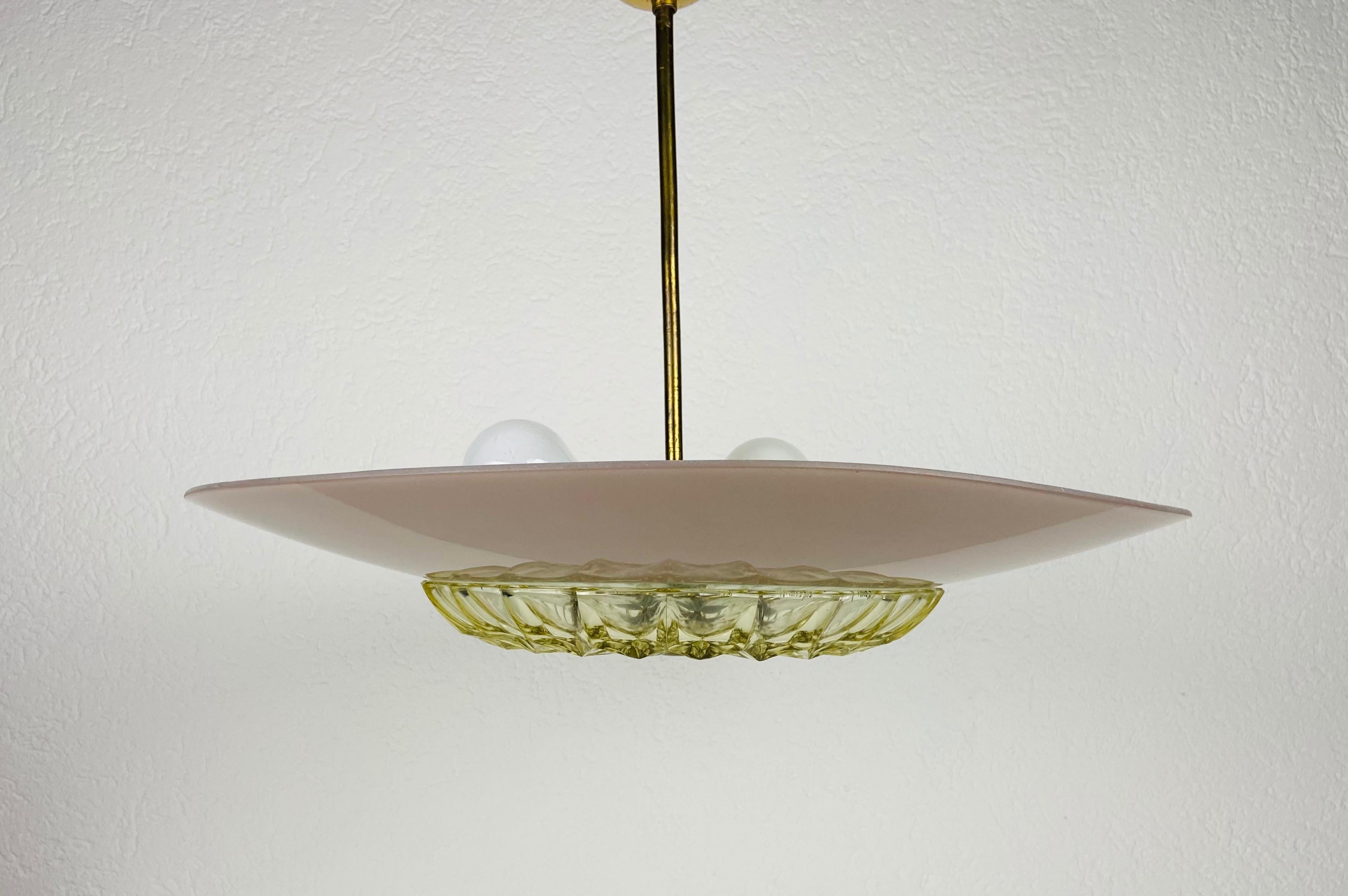 Mid-Century Modern pendant lamp in the style of Boris Lacroix made in the 1960s. The shade is made of glass and the bar is made of brass.

The light requires two E27 (US E26) light bulbs. Good vintage condition.

Free worldwide express shipping.