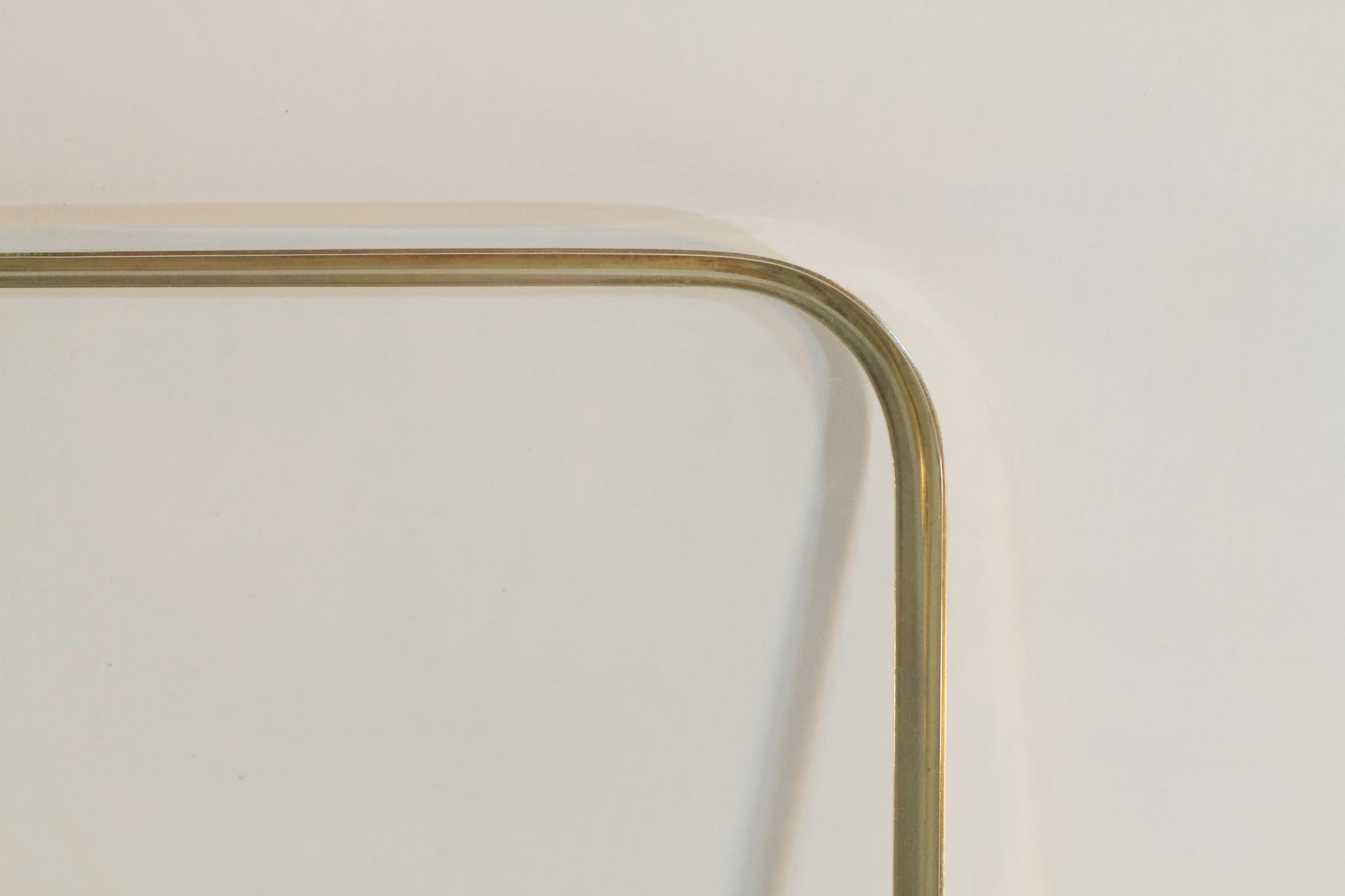 A 1950s single tray in solid brass centered around glass.