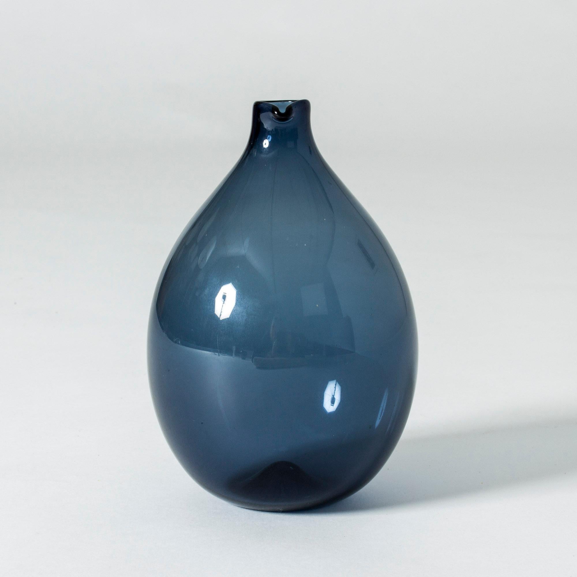 Beautiful glass vase or decanter by Timo Sarpaneva, in a light, soap bubble like shape in dark blue.