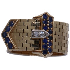 Vintage Midcentury Gold Buckle Ring with Diamonds and Sapphires
