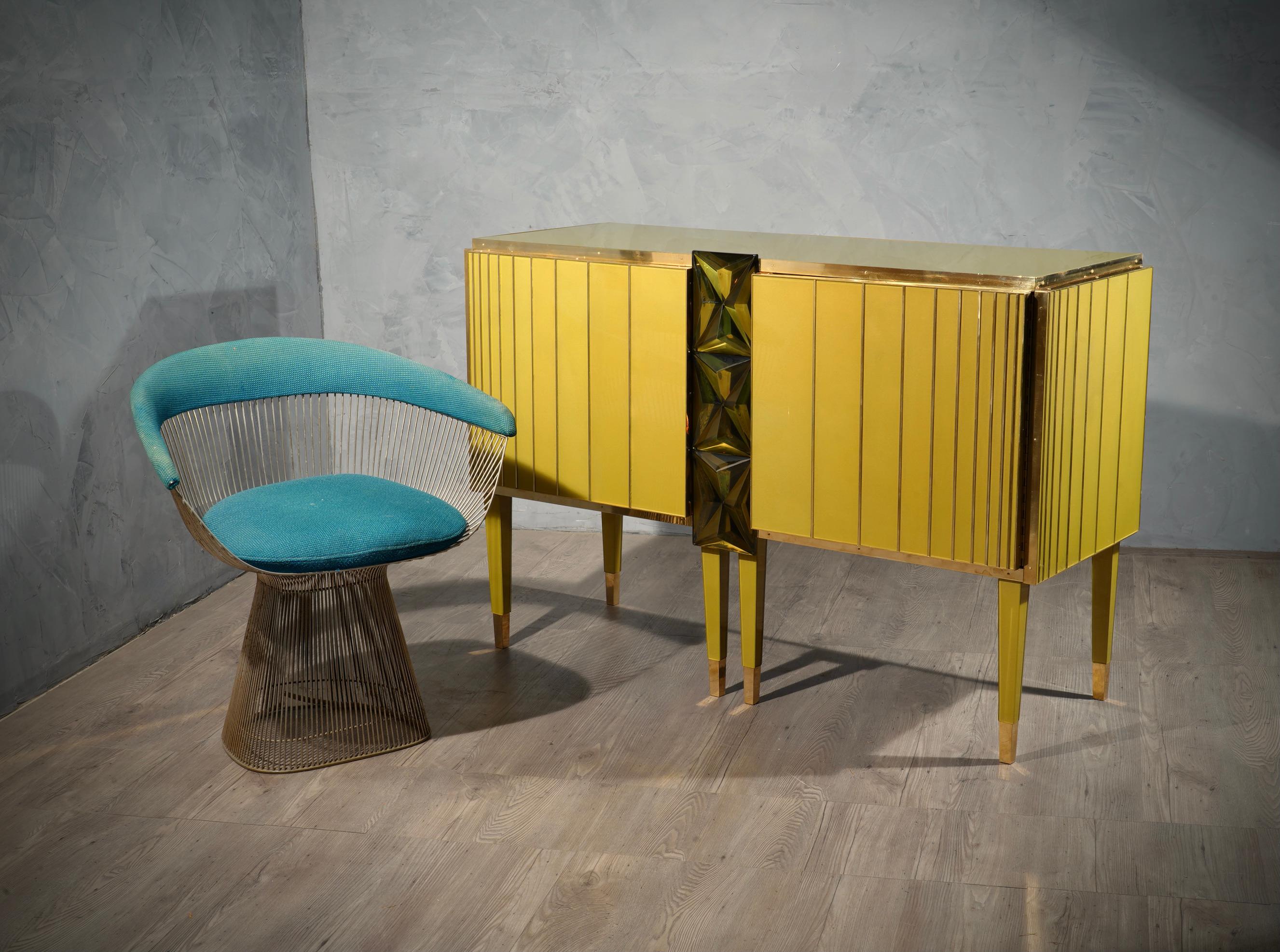 A unique sideboard of its kind for its originality and also for these three Murano green glass bricks. Full customization. Simple but refined design, note the briar veneer and well polished internal part.

The sideboard has a wooden structure, which