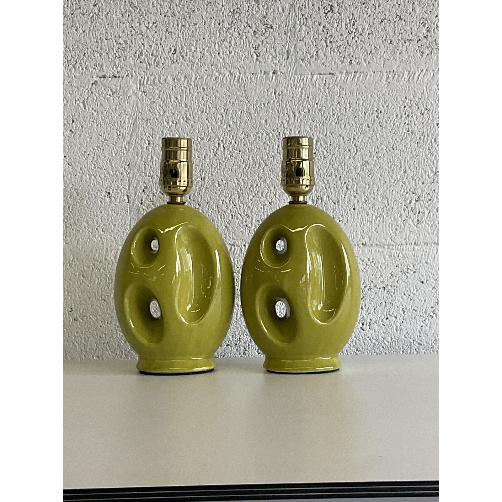 Fabulous pair of vintage MCM boudoir lamps. Chic little Abstract forms in a brilliant chartreuse green. All new wiring and hardware done by Heath Lighting in Palm Beach. Acquired from a Palm Beach estate.