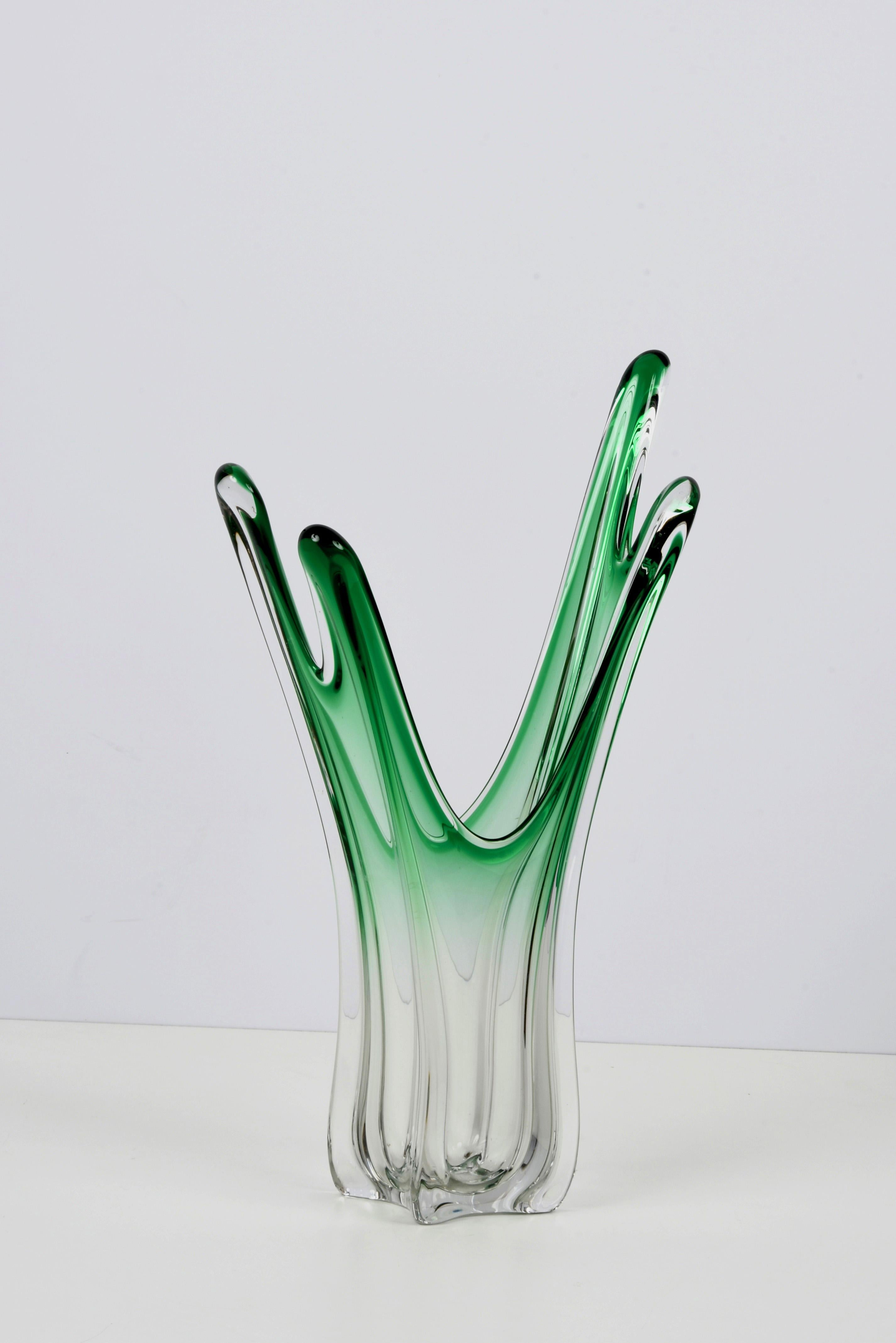 Large submerged Murano art crystal and green glass vase. This wonderful item was produced during the 1950s in Italy and it is attributable to Fratelli Toso Murano.

This masterpiece is fantastic because of the amazing green gradient colour that