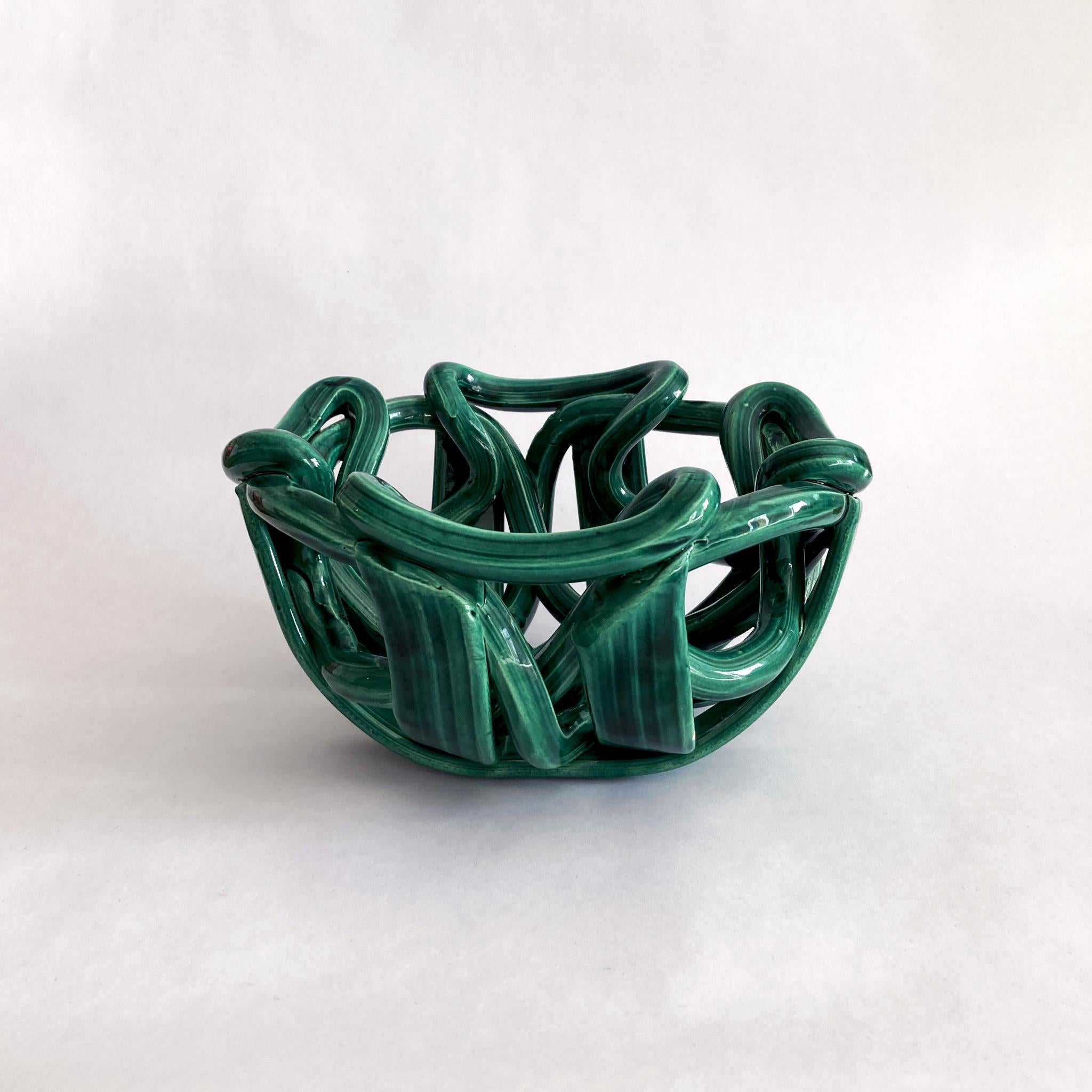 Stunning woven braided ceramic centerpiece bowl glazed in a wonderful shade of green. Great size for a coffee table or entryway. Very unusual abstract shape, pleasing from every angle. Not signed. In good vintage condition, no cracks or crazing.