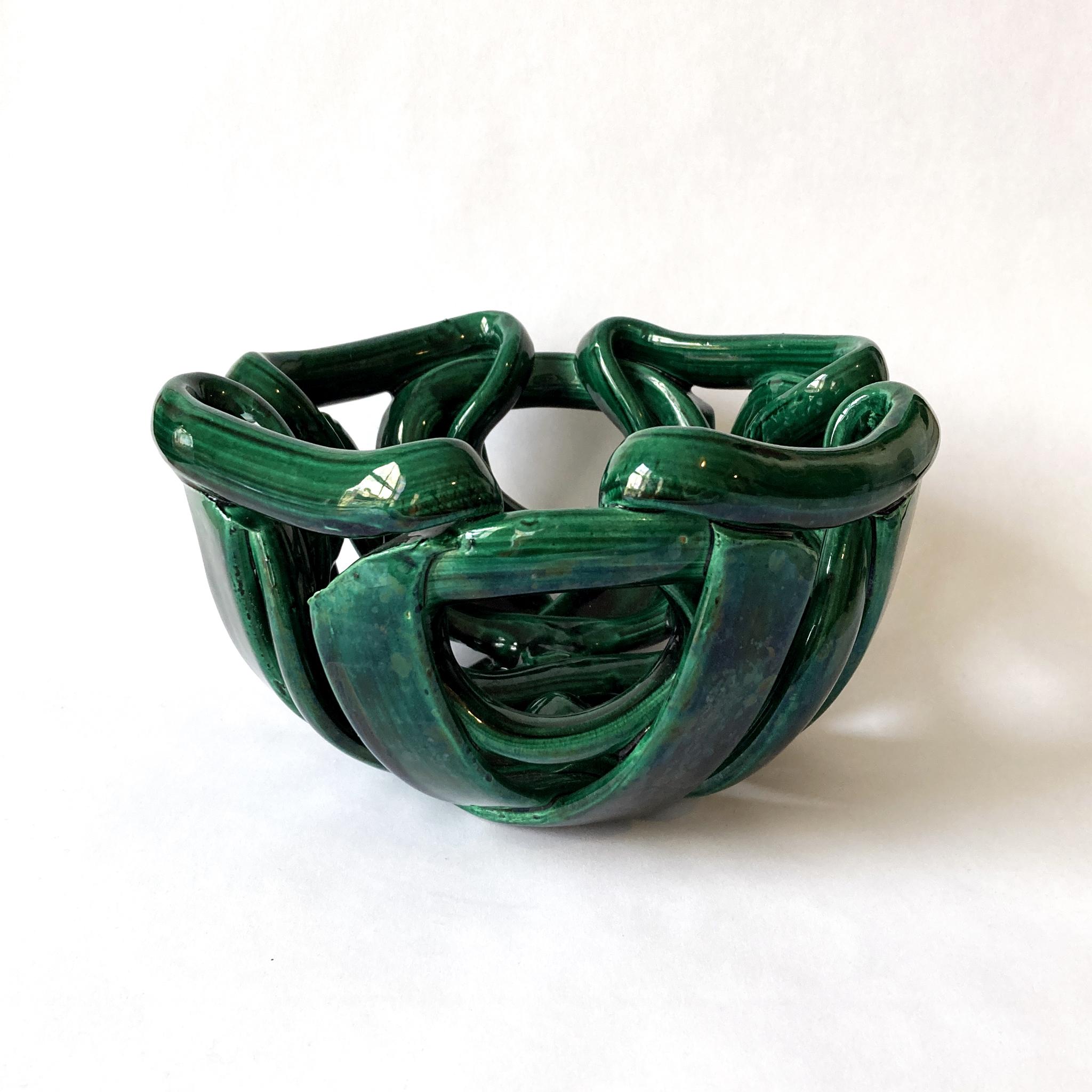 Stunning woven braided ceramic centerpiece bowl glazed in a wonderful shade of green. Great size for a coffee table or entryway. Very unusual abstract shape, pleasing from every angle. Not signed. In good vintage condition, see condition details.