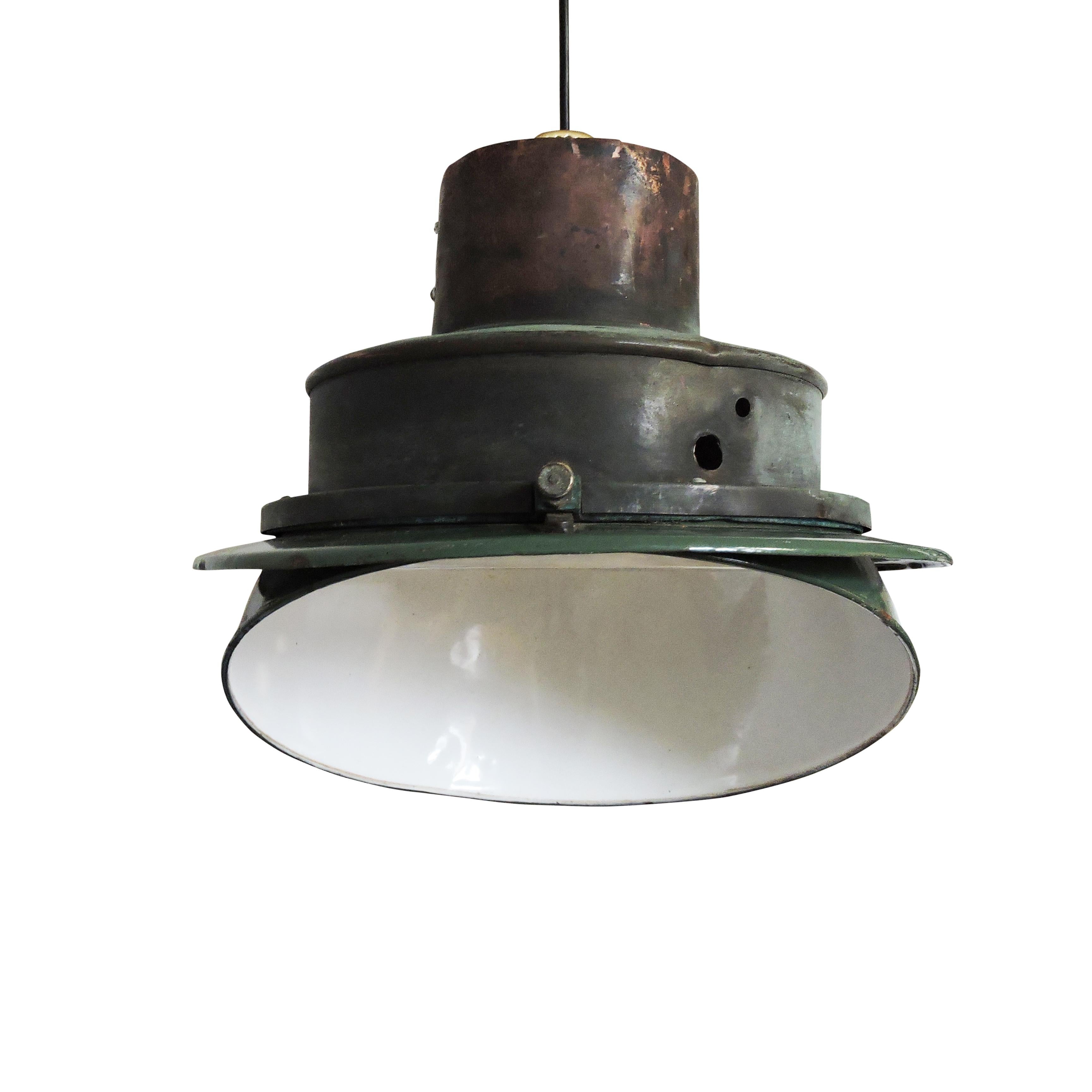 A 1950s midcentury green industrial angled enamel pendant lamp.

A professional electrician has rewired this piece to be in working order.

Plug type - UK plug (up to 250V).