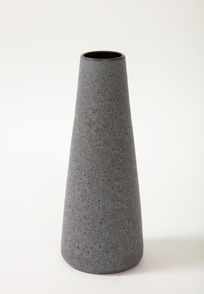 Midcentury Grey and Black Cylindrical Lava Glazed Vase

Textured glazed ceramic vase in contrasting black and grey. Simple effective shape with great height; perfect for a ceramics grouping.

