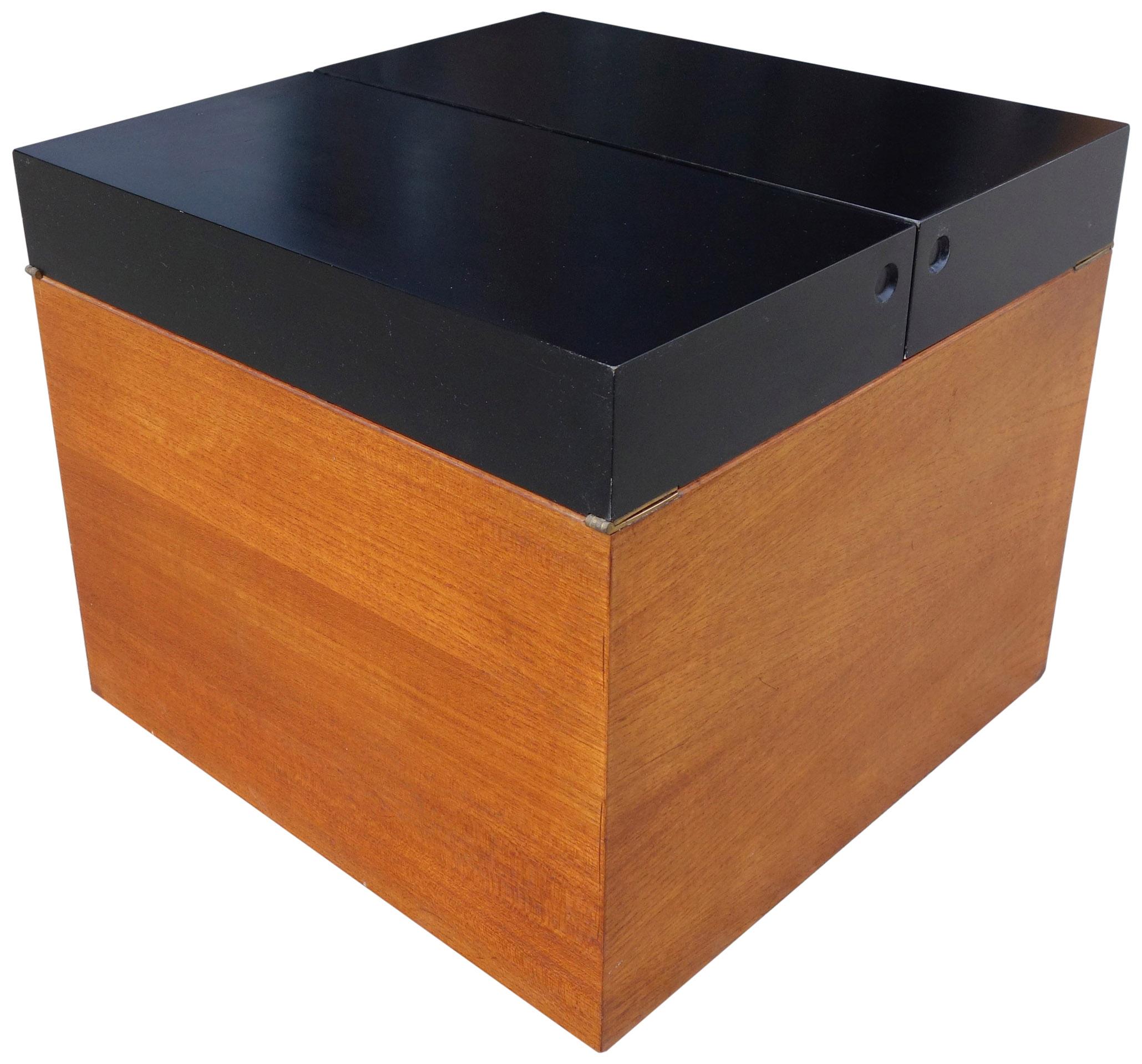 For your consideration is this wonderful bar cube that can also be used as a side table or even a small coffee table. Featuring teak wood with a black lacquer top on a floating rolling base. Inside reveals storage shelves and one removable
