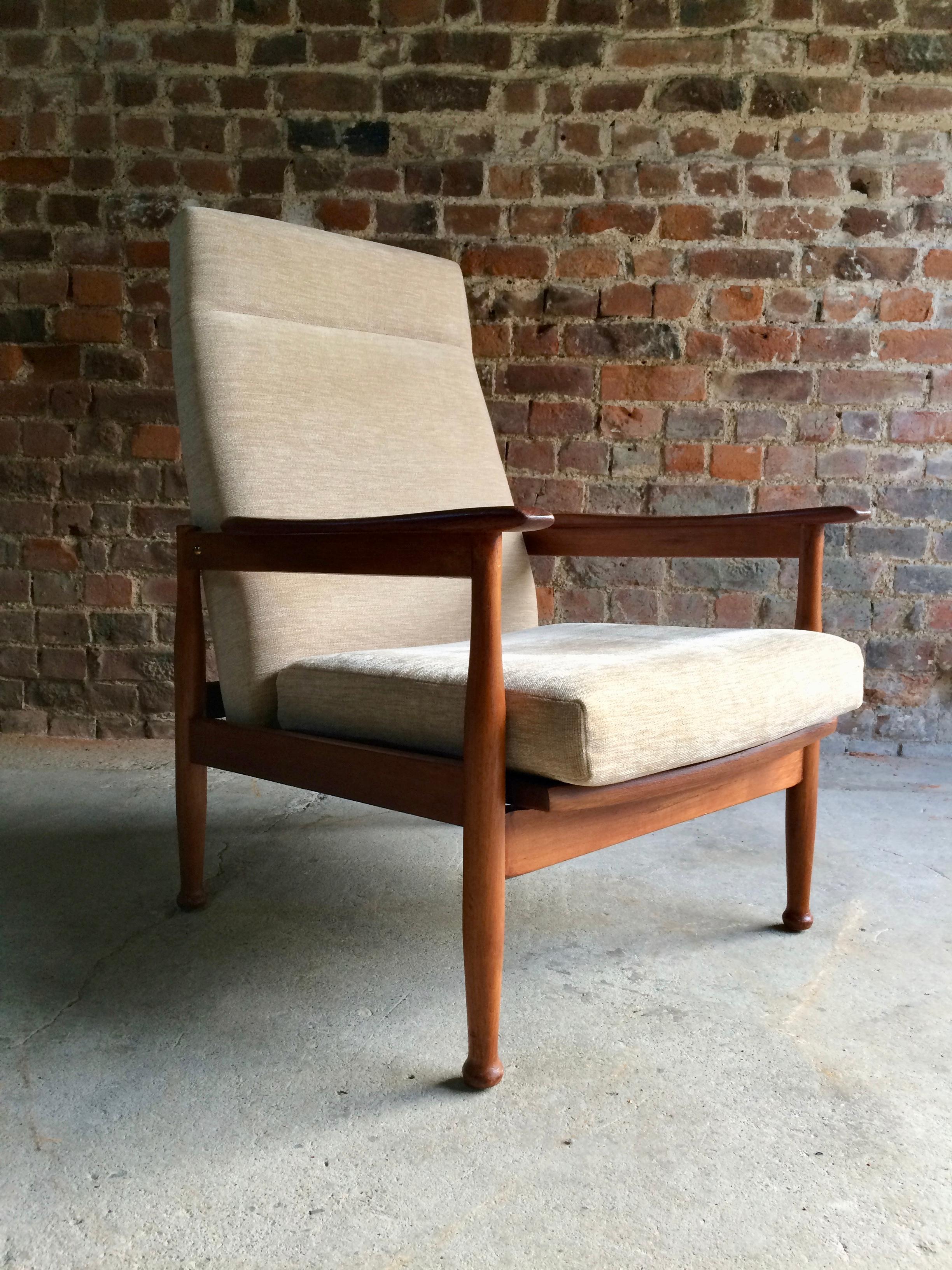 

Midcentury guy Rogers Manhattan teak armchair and footstool, circa 1960s, beautiful teak framed armchair that has been re upholstered in a cream velour fabric, three stage reclining action, with matching footstool ottoman offered in superb