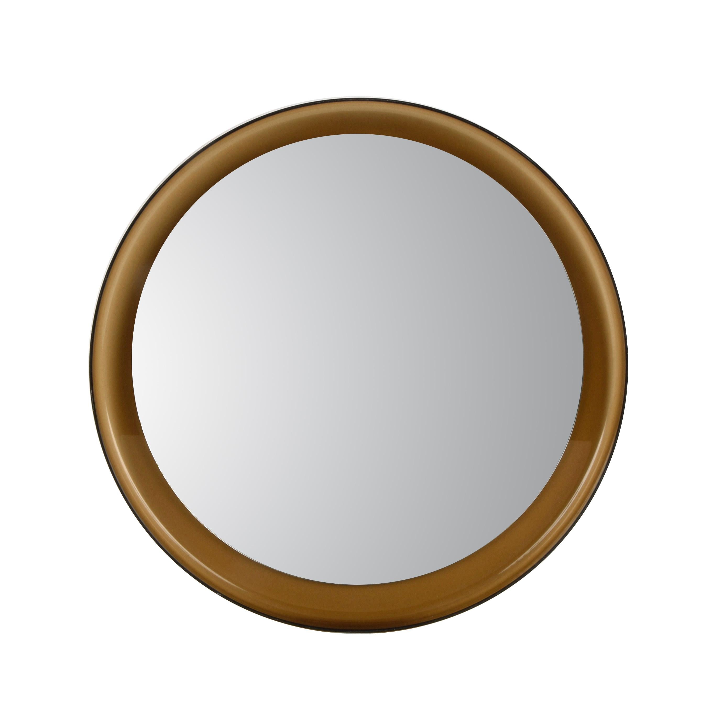 Amazing Mid Century smoke brown lucite wall mirror & wall mirror. This incredible object was produced in Italy in the 1960s.

This striking piece has a wonderful round brown lucite frame and a mirror. The conditions are good and original give