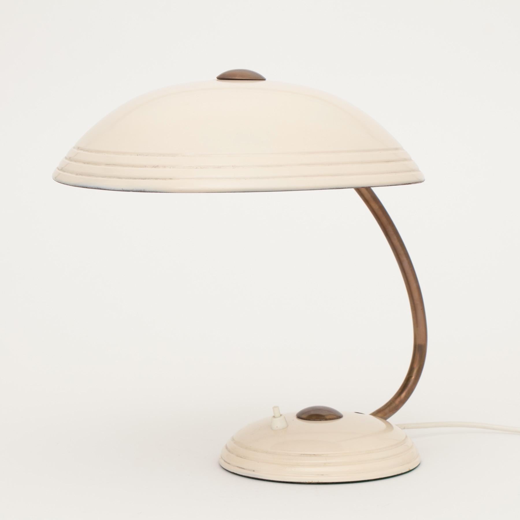 Midcentury halo flying saucer desk lamp with original paint finish in fantastic condition.
Netherlands,
circa 1960.
Measures: H 35.5cm, W 38cm, D 31cm.