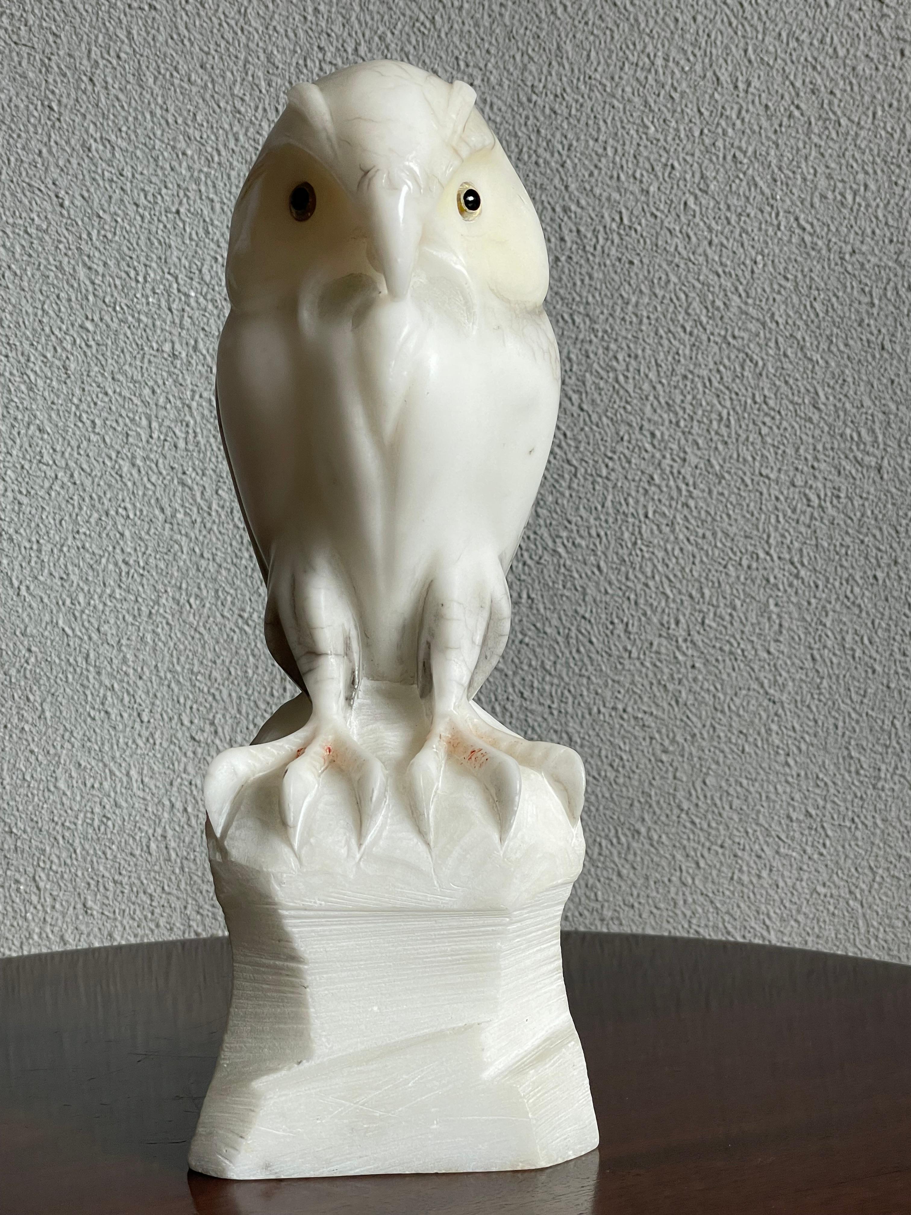 Mint condition and beautifully handcarved alabaster owl sculpture.

This incredibly well carved barn owl from the midcentury era clearly was well loved by it's previous owners, because after all those years it still is in magnificent condition.
