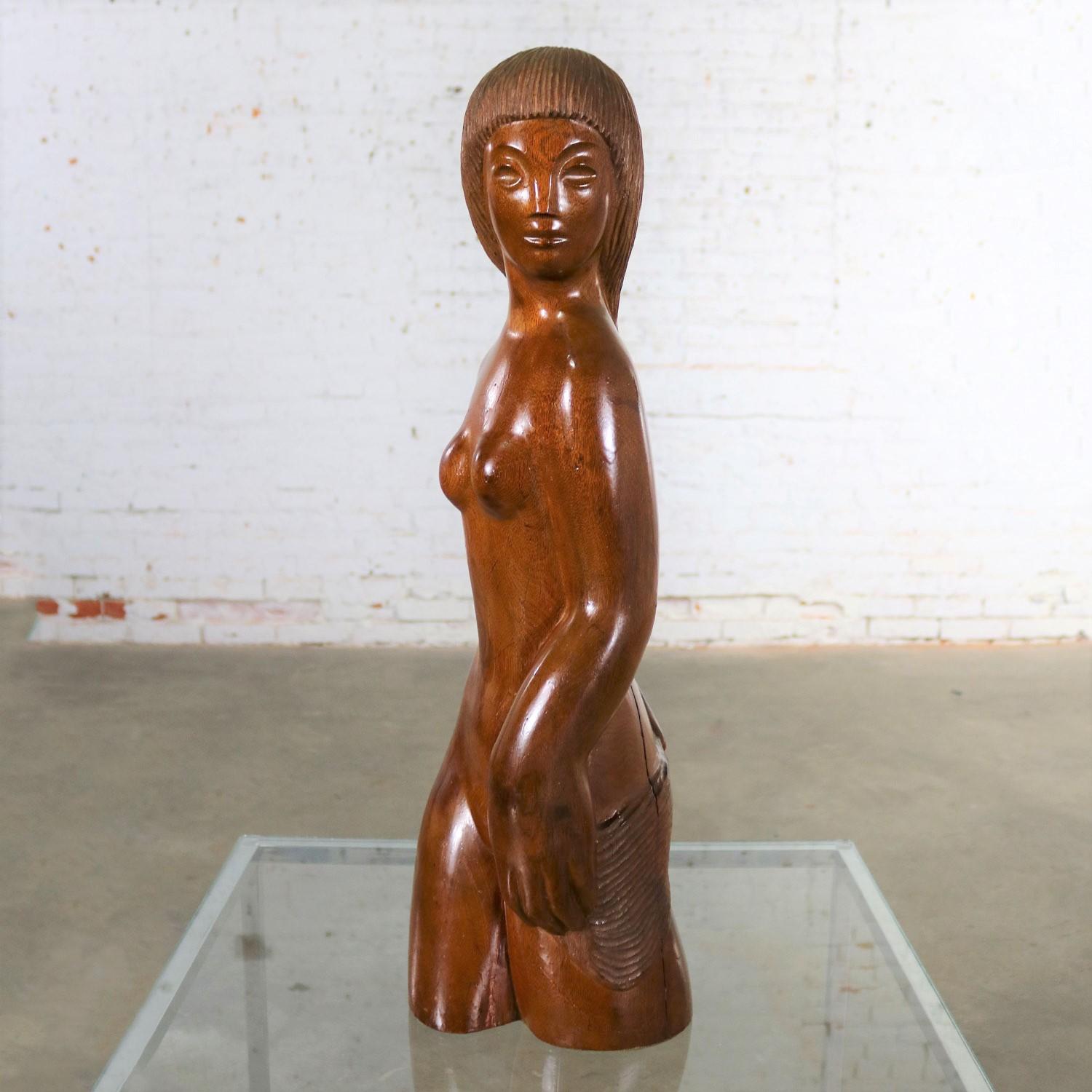 Beautiful and large hand carved wood Mid-Century Modern female nude sculpture. She is in fabulous vintage condition. Unsigned, circa 1940s-1960s.

I’m not sure what country she is from, but she is a beauty! This large scaled female nude hand