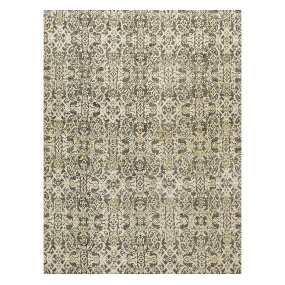 A vintage Persian Mahal room size rug handmade during the mid-20th century with a Classic Herati pattern in grey-brown, hints of teal, and a light beige border.