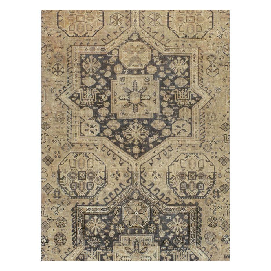 A vintage Persian Tabriz room size city rug handmade during the mid-20th century. The double octagram medallion, diamond border, and other motifs are influenced by tribal rugs, primarily Caucasian, but the execution is totally in the Persian Tabriz