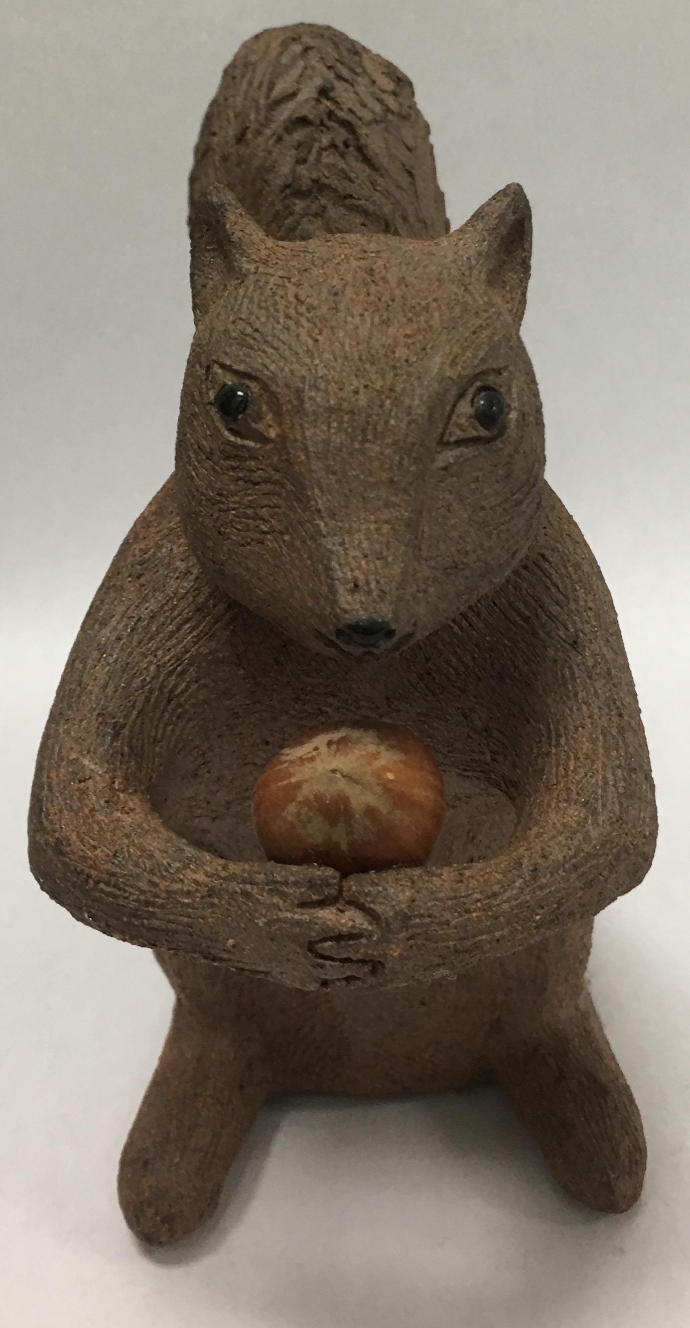 Midcentury handmade terra cotta squirrel figurine.