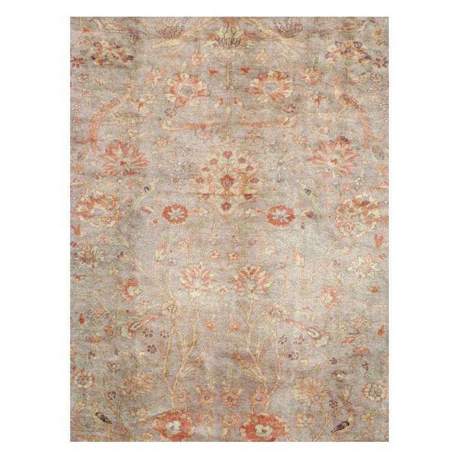A vintage Turkish Oushak room size area rug handmade during the mid-20th century with a very soft mushroom color that leans towards purple and a soft rust-red border.

Measures: 9' 2