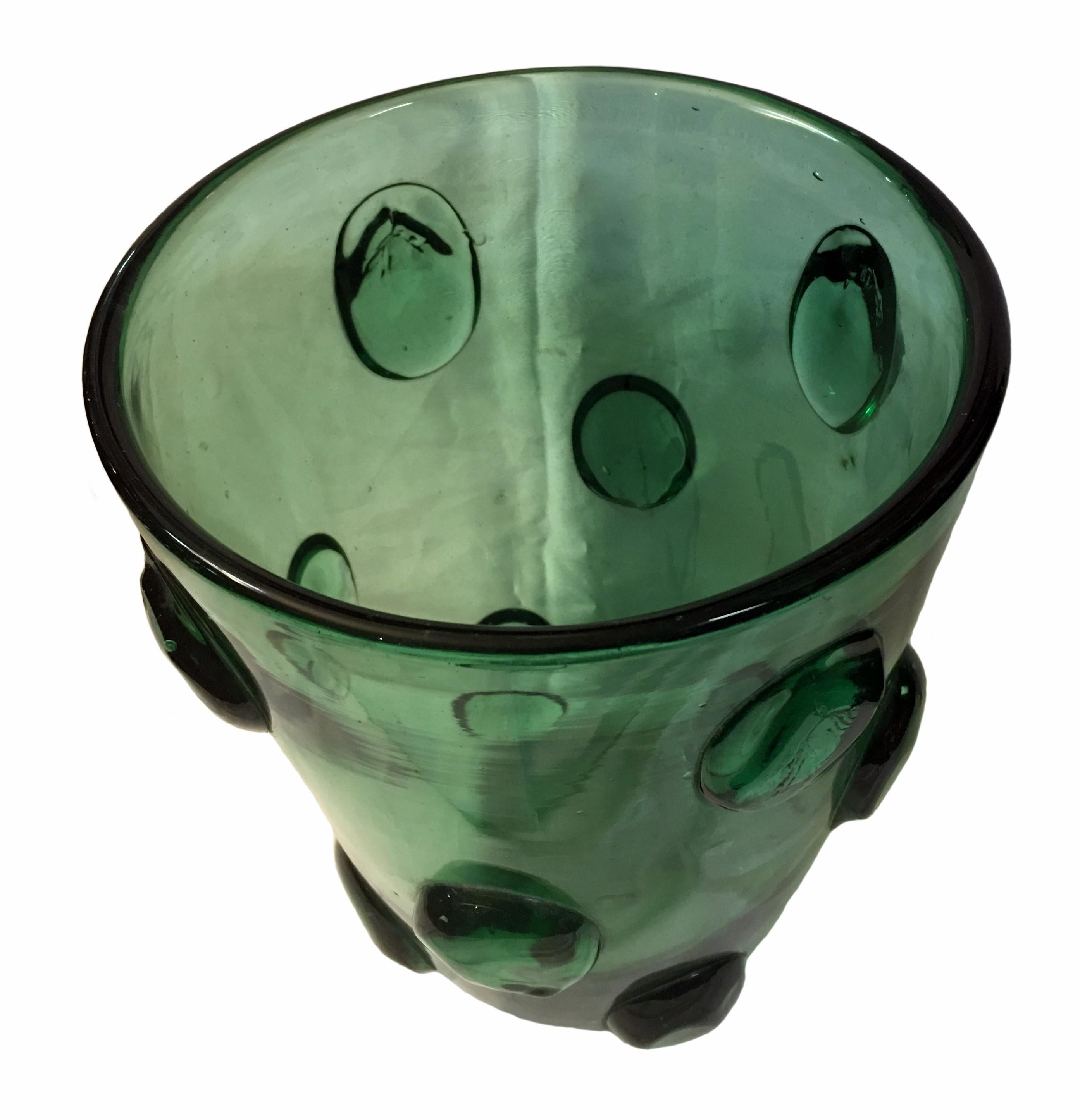 A very nice and large vase in bottle green hand blown and produced in Murano in the 1960s. Has a very nice sculptural design and looks nice with flowers as well as on it´s own.