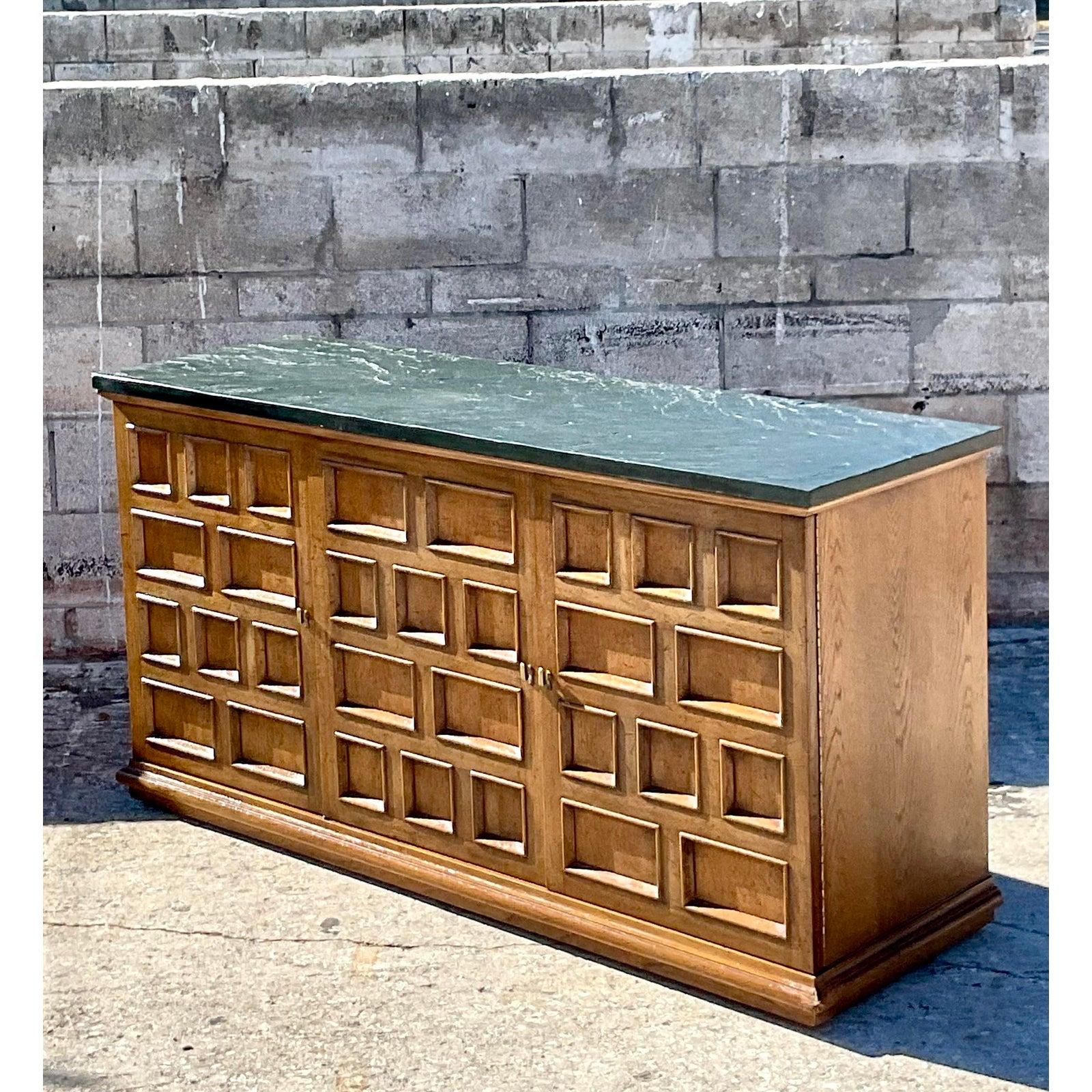 Fantastic vintage MCM Henredon credenza. A chic block Millwork design with a thick slate top. Super stylish. Three additional drawers for storage and an open area for shelving. Acquired from a Palm Beach estate.
