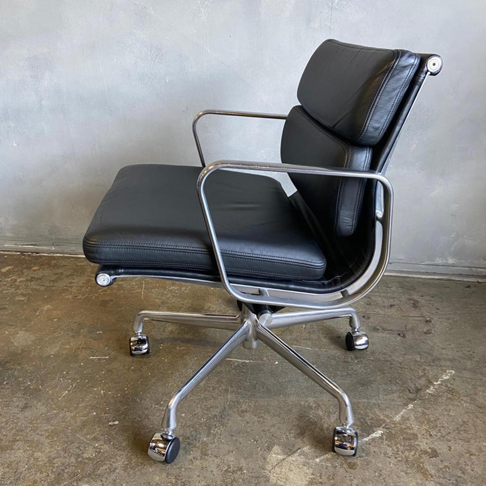 Eames for Herman Miller Soft Pad Executive chairs in black leather with low back. Full manual tilt, height adjustment, and swivel with carpet / hardwood casters. Near new old stock. Leather looks almost new and probably never sat on. 

These