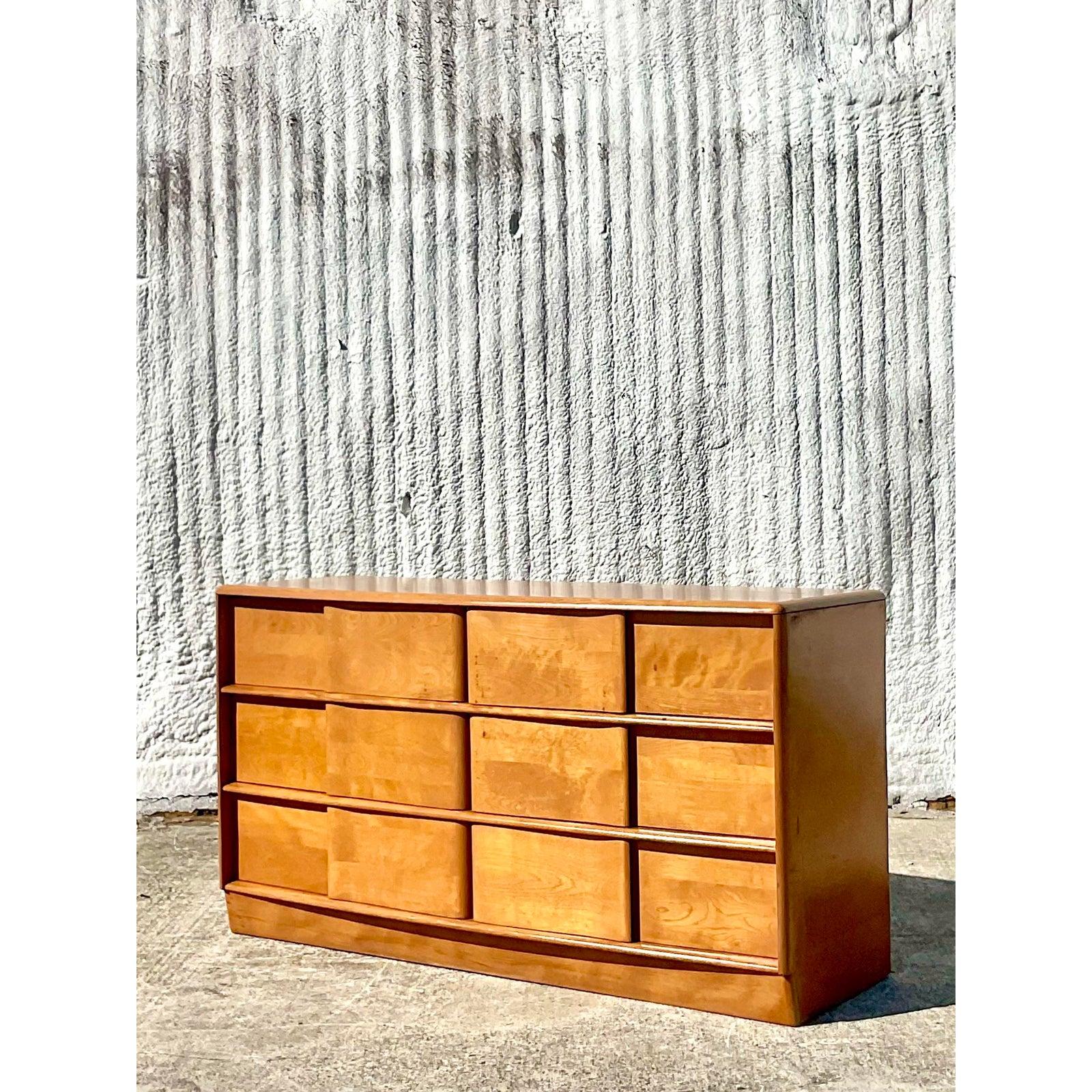 Stunning vintage Heywood Wakefield low dresser. From the coveted “Sculptura” collection. Six drawers and a warm honey color. Acquired from a Palm Beach estate.