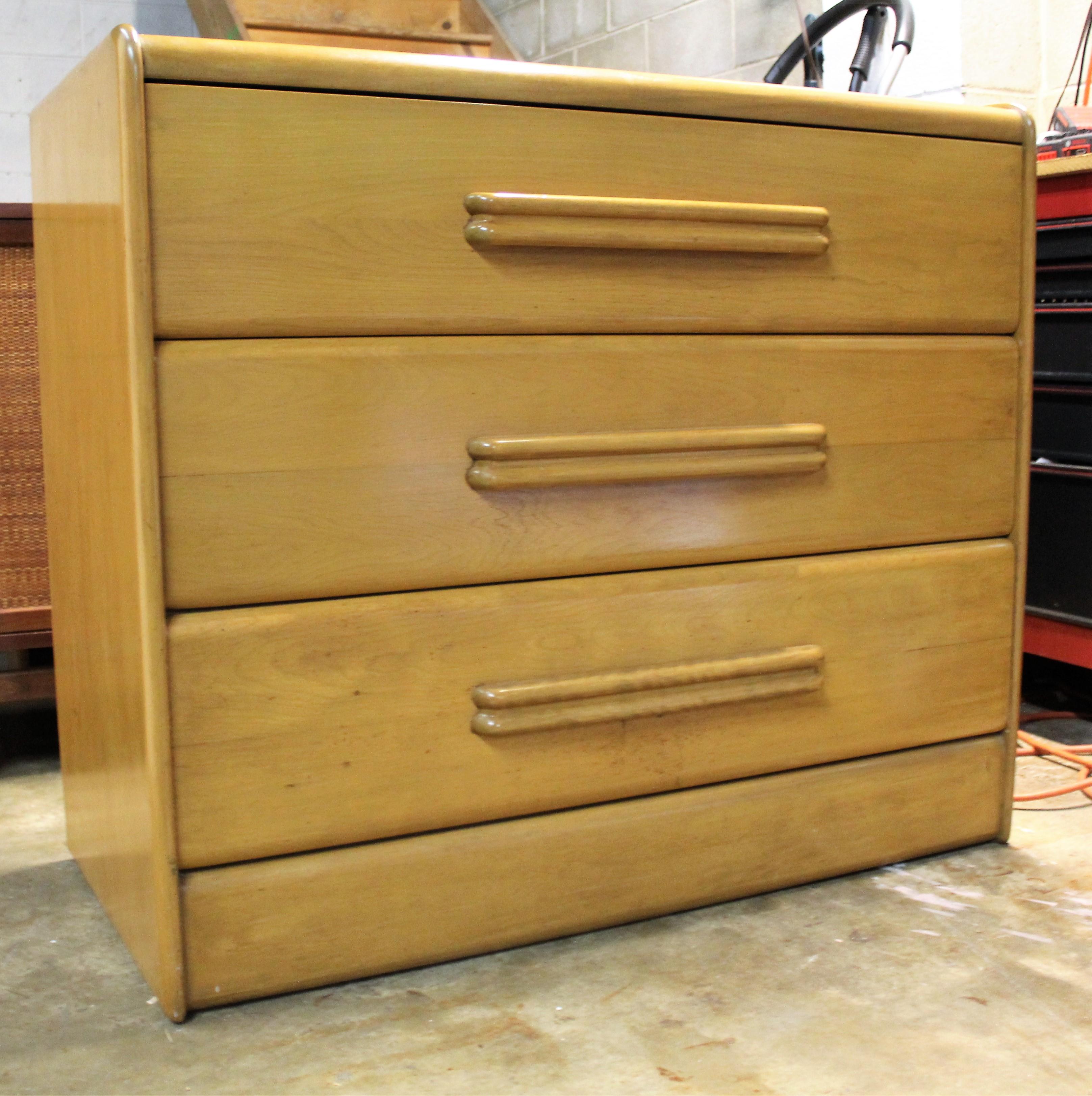 Offered is a Heywood Wakefield bachelor chest with a wheat finish. The piece is in good condition considering its age, circa 1940s, showing some age wear. It is signed Heywood Wakefield. A great piece to add to any room in your