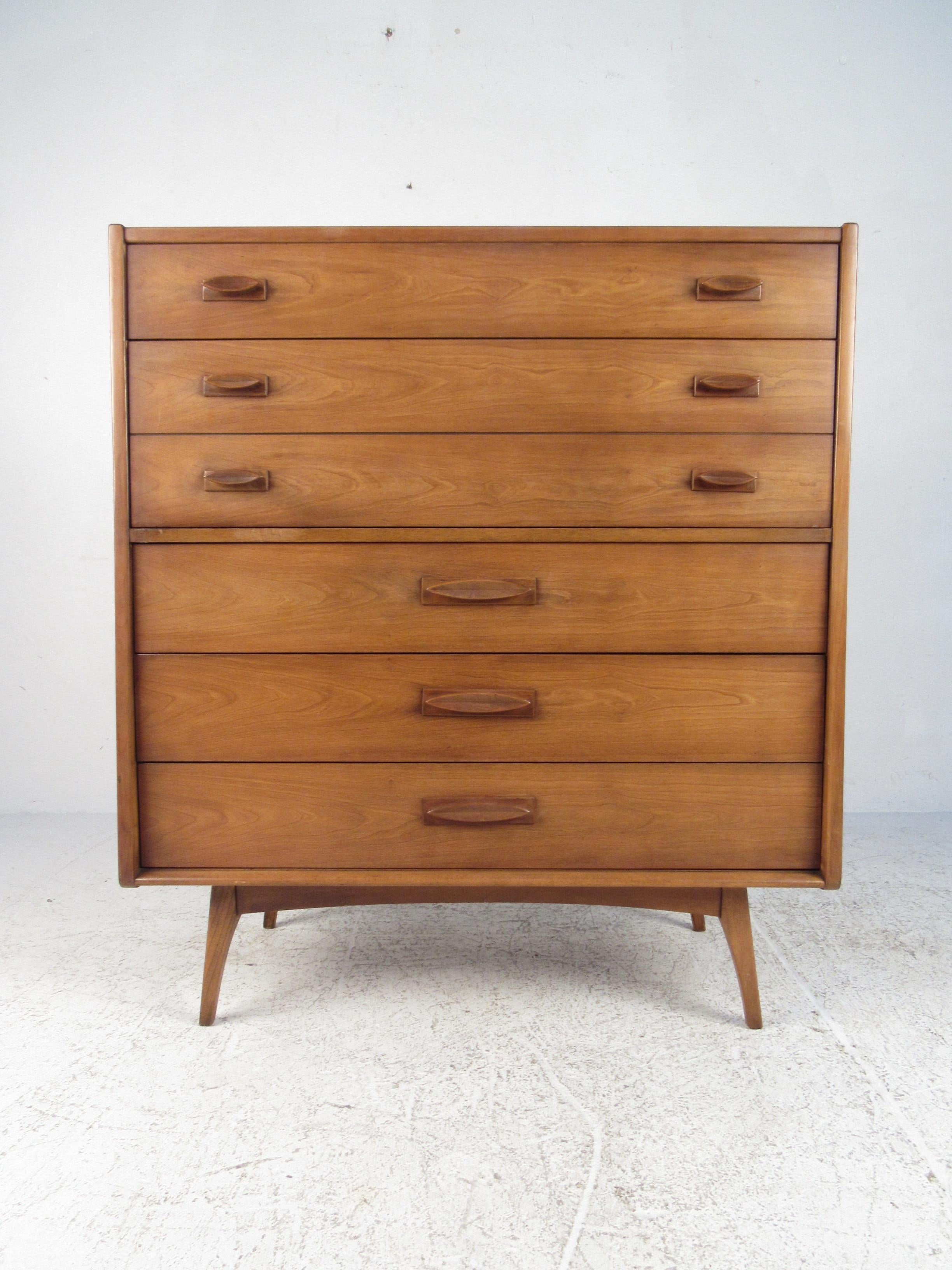 This beautiful Mid-Century Modern highboy dresser has wonderful matching drawer pulls and simple, modern lines. Plenty of stylish storage for any bedroom. “Contact dealer” for more photos or information on individual pieces, please confirm item