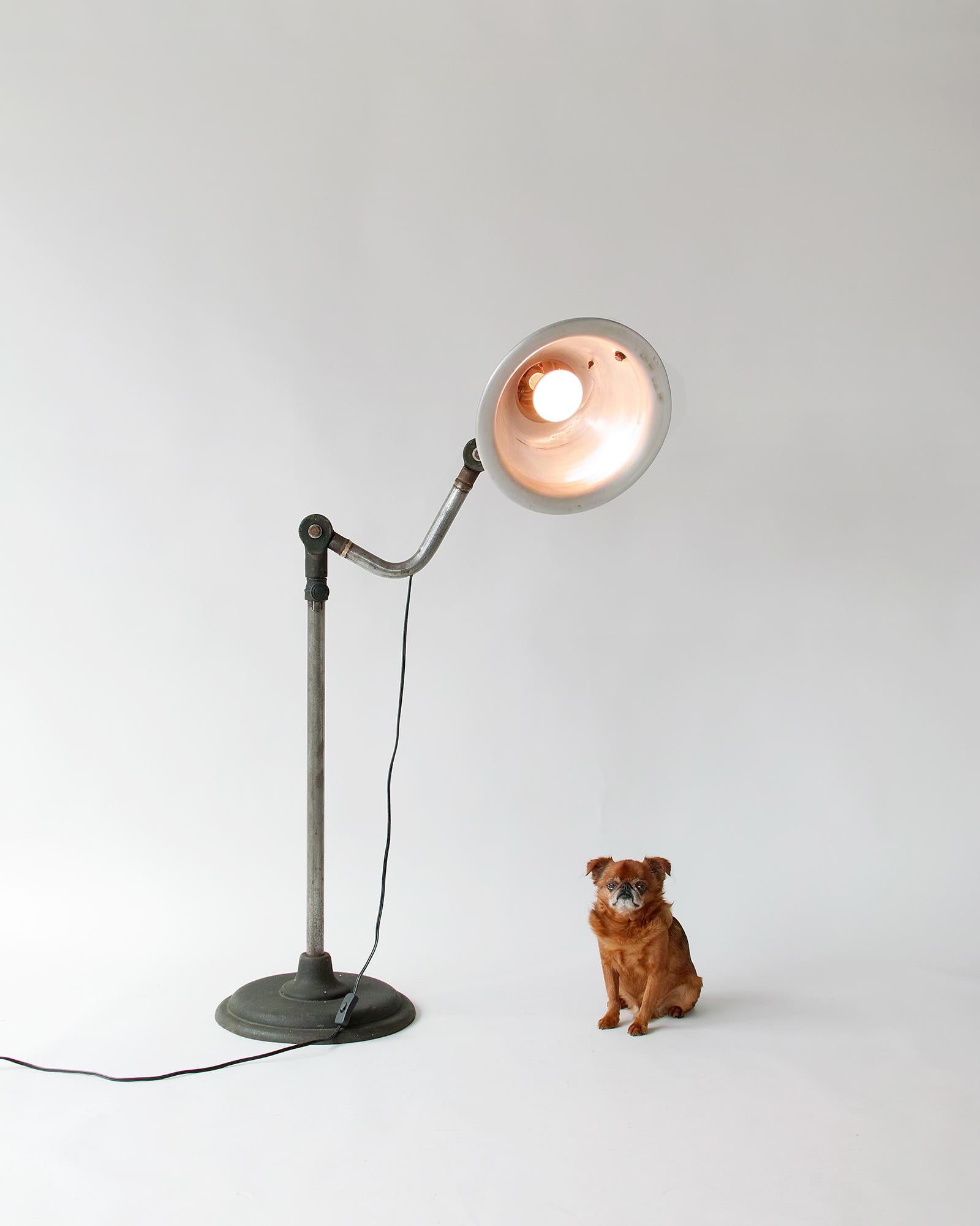 For your consideration is this mid-century industrial lamp by M. Brandt & Son featuring a telescoping steel shaft, two rotating joints, and a tilt/swivel aluminum shade. This highly functional lamp has its original surface with nice aged patina and