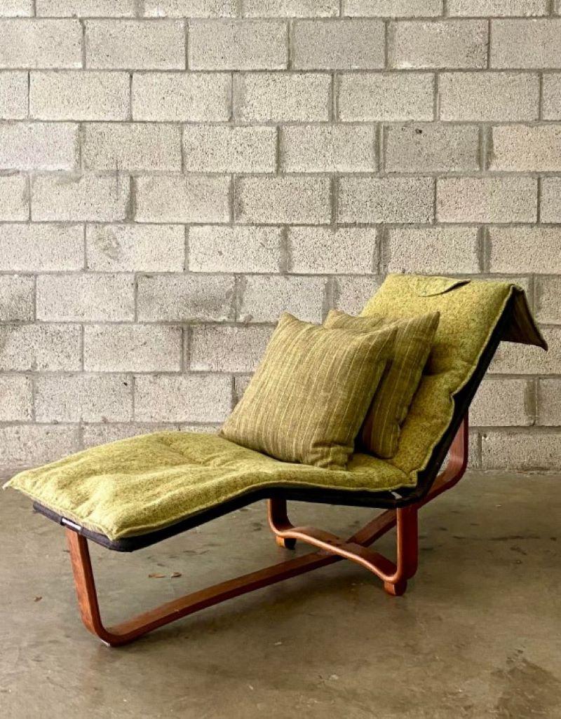 Exceptional mid-century chaise lounge. Designed by Ingmar Relling and produced by Westnofa. Beautiful bent wood floating frame with a reversible cushion. Acquired from a Palm Beach estate.
