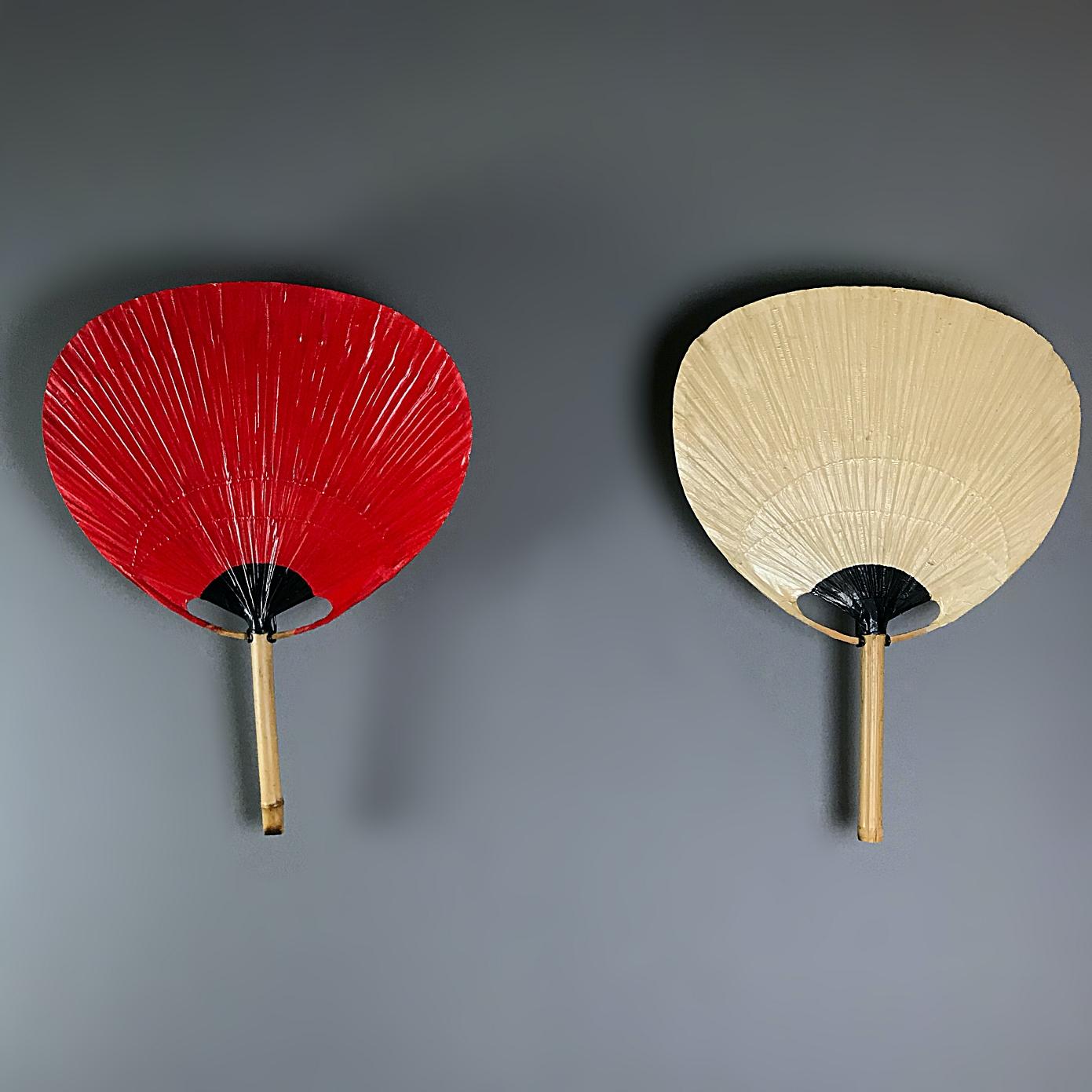 Beautiful Ingo Maurer Uchiwa ll fan lamp with metal holder for wall hanging. The lamp is made of natural bamboo and rice paper by artisans in the 1970s. The metal holder is equipped with an original Edison bulb holder, a new white wire with on/off