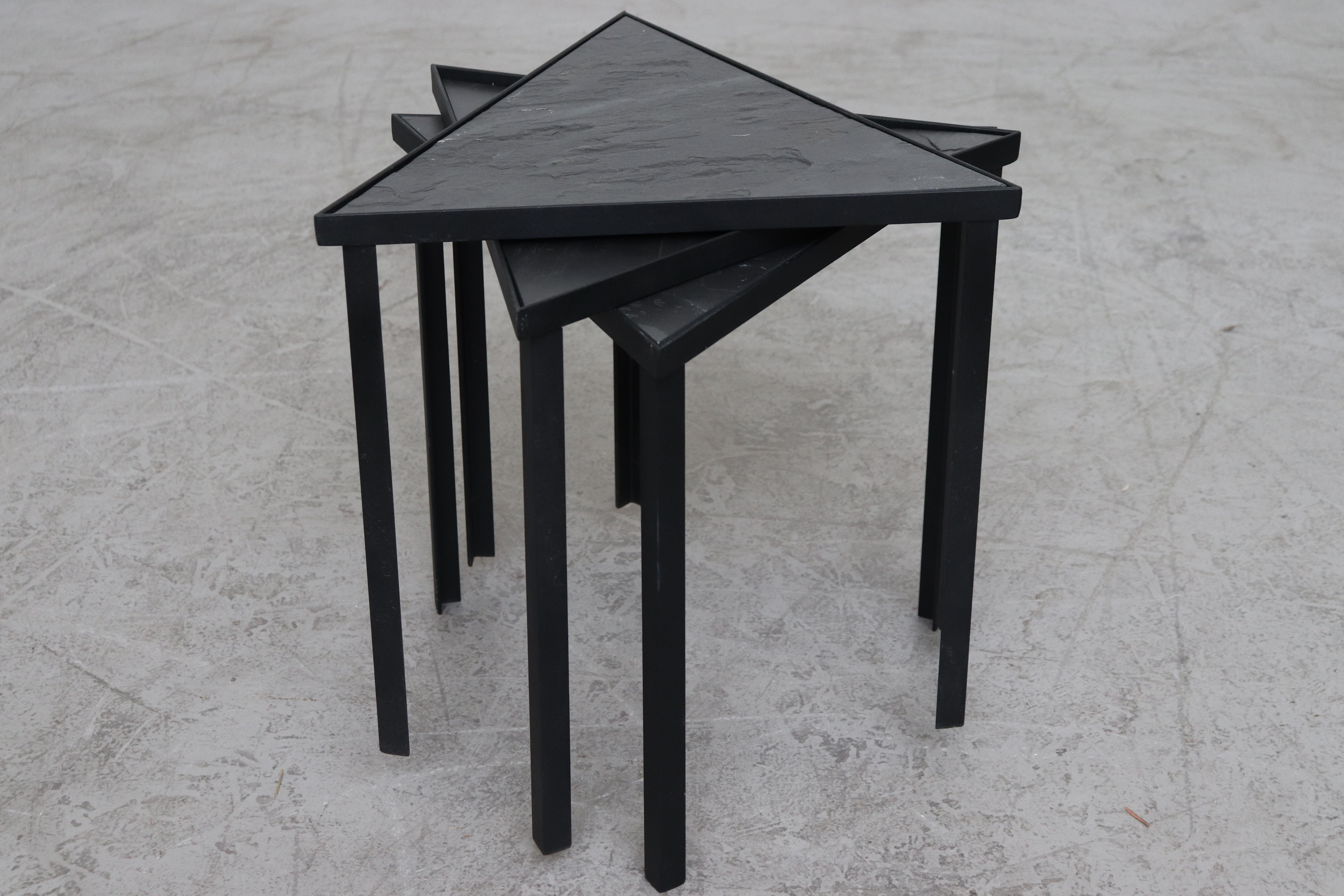 Midcentury inspired triangle slate and metal tables
Set of 3 stacking tables
Black powder coated frame
Measures: 16” x 15” x 16”.
 