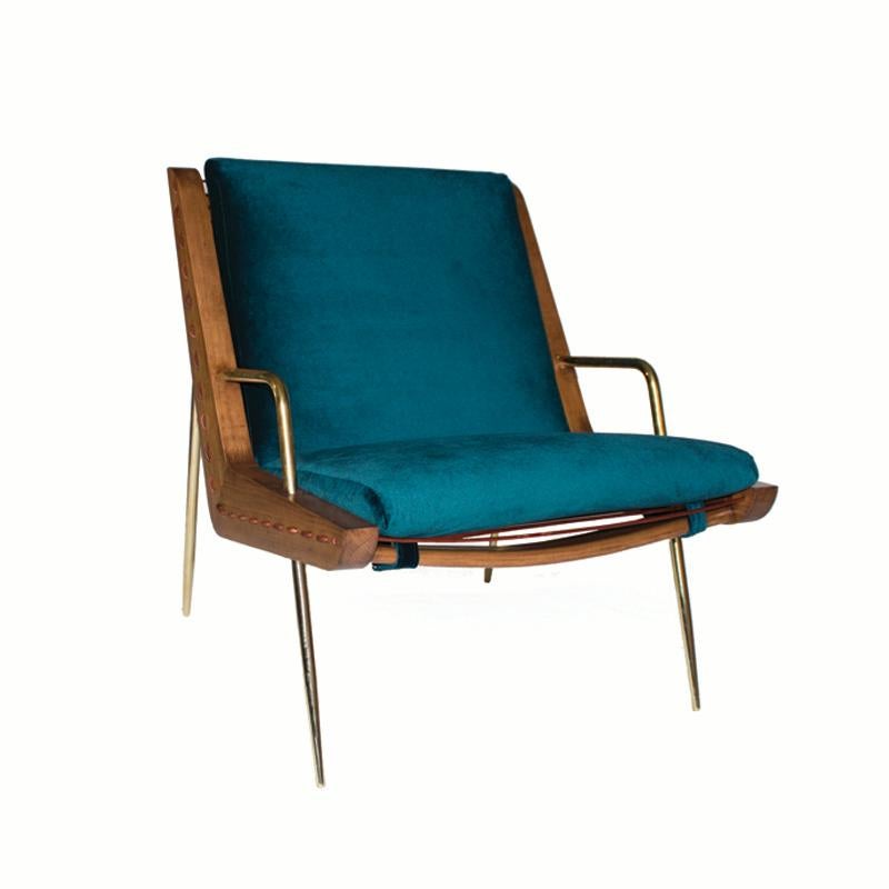 The handcrafted midcentury inspired lounge chair and ottoman are a unique creation by Leon Leon Design from Mexico City. It features a solid maple wood frame, handwoven with a 5 mm natural leather cordon and solid brass legs. It comes with an