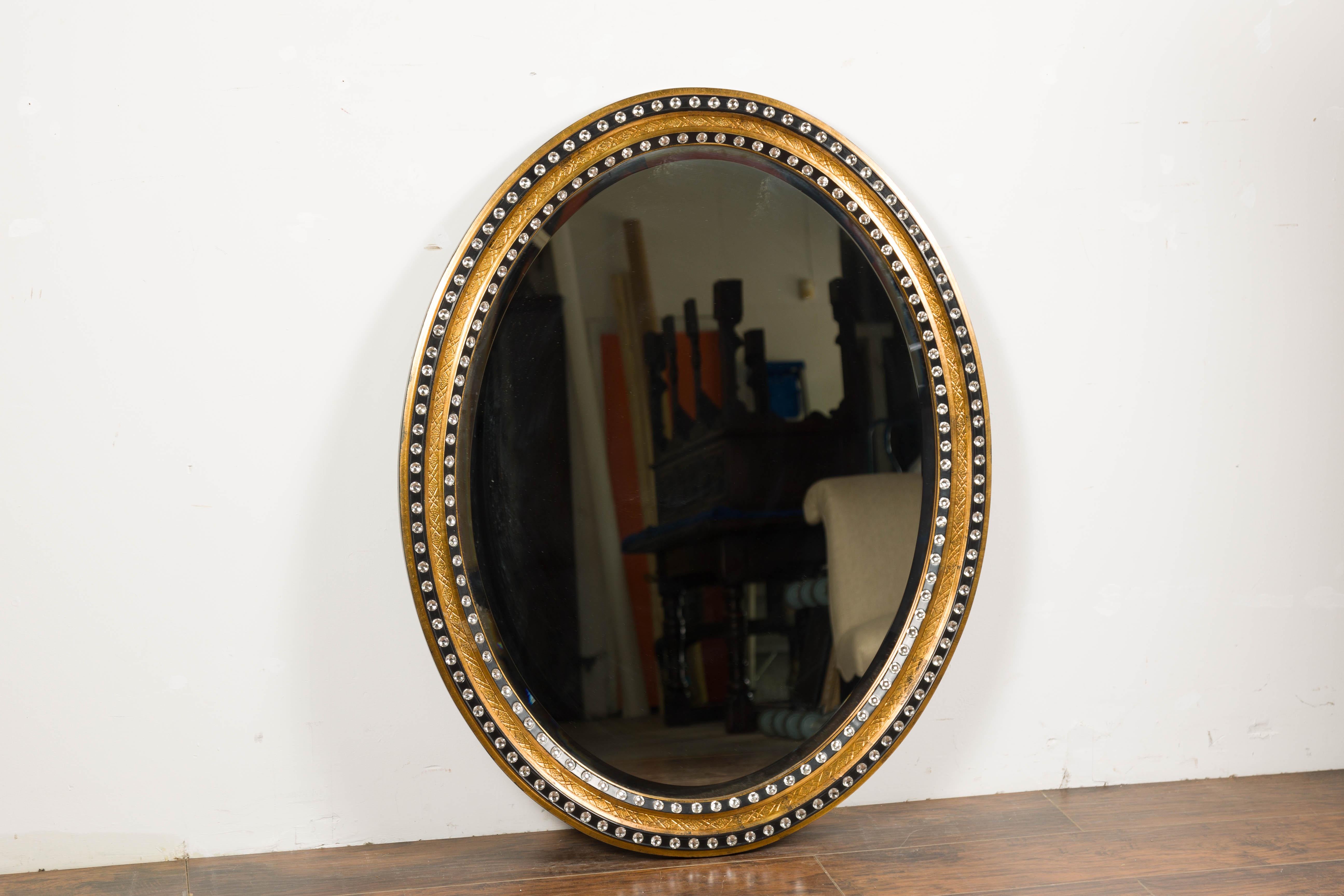 Mid-Century Modern Miroir irlandais du milieu du siècle, ovale, doré et noir, avec décor diamanté en vente