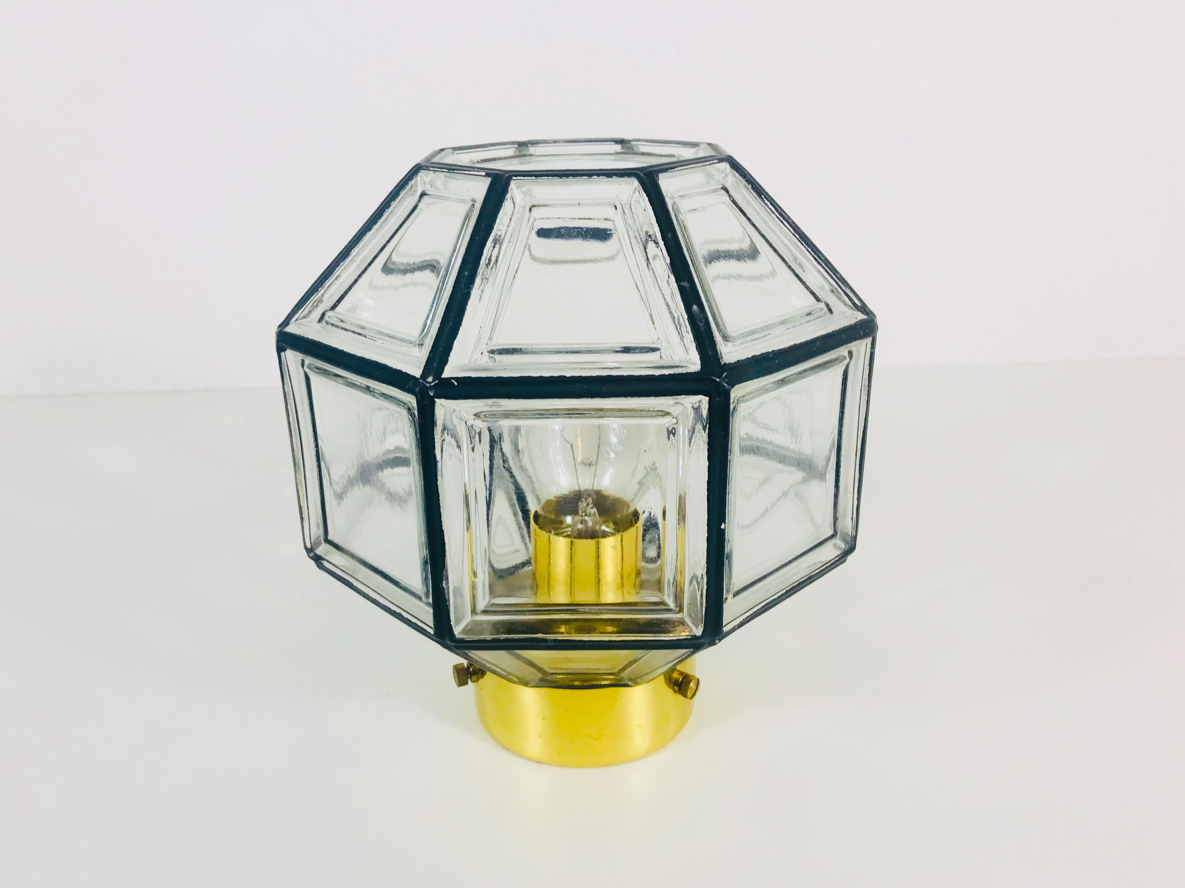 A Mid-Century Modern flush mount by Glashütte Limburg made in the 1960s in Germany. It is fascinating with its beautiful square shape and bubble glass. The fixture has a very nice Minimalist design.

The light requires one E27 light bulb.